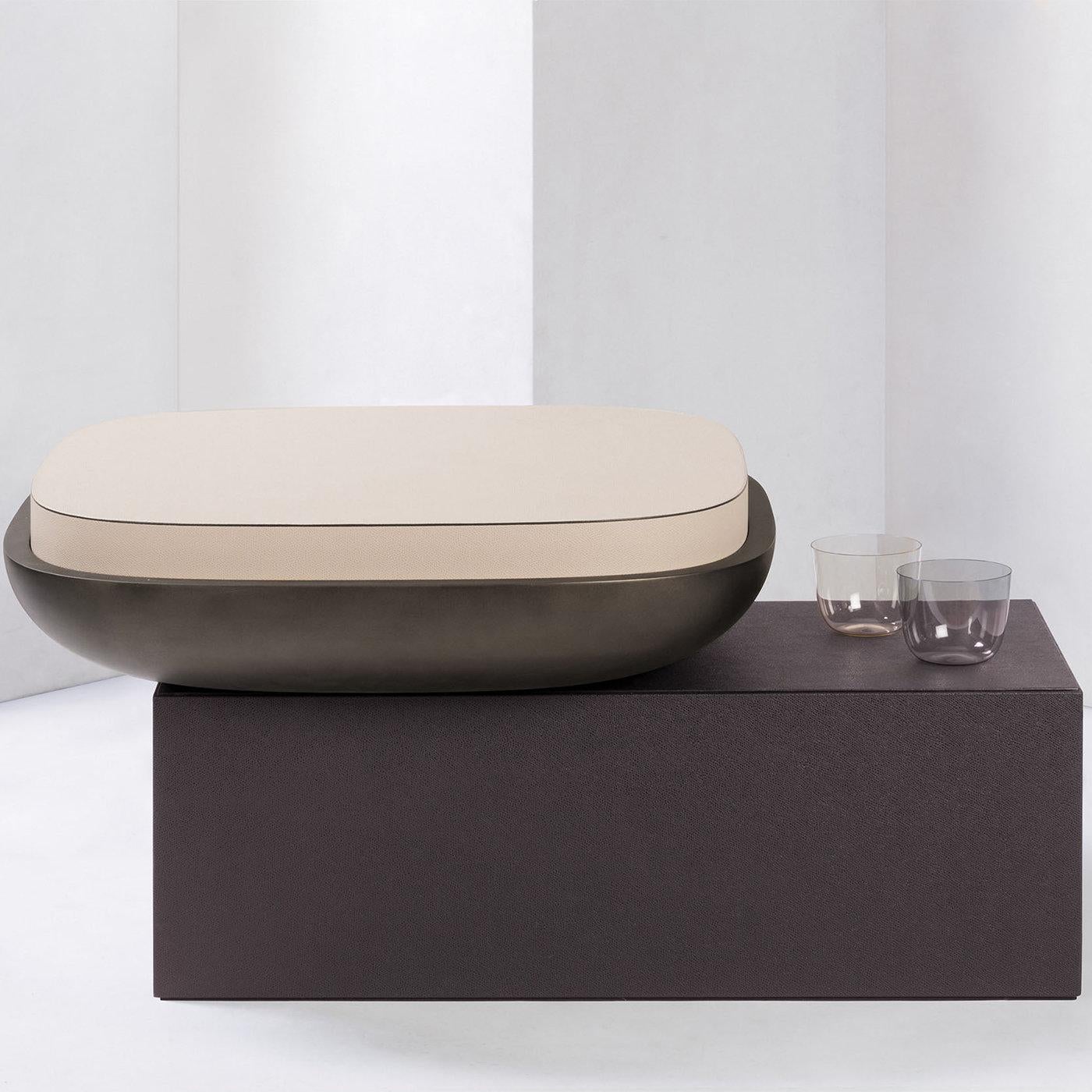 Contemporary leather stool & table - Olympia by Stephane Parmentier for Giobagnara.
The object presented in the image has following finish: G28 cipria printed calfskin golf leather (top), G25 Moka printed calfskin golf leather (base) and