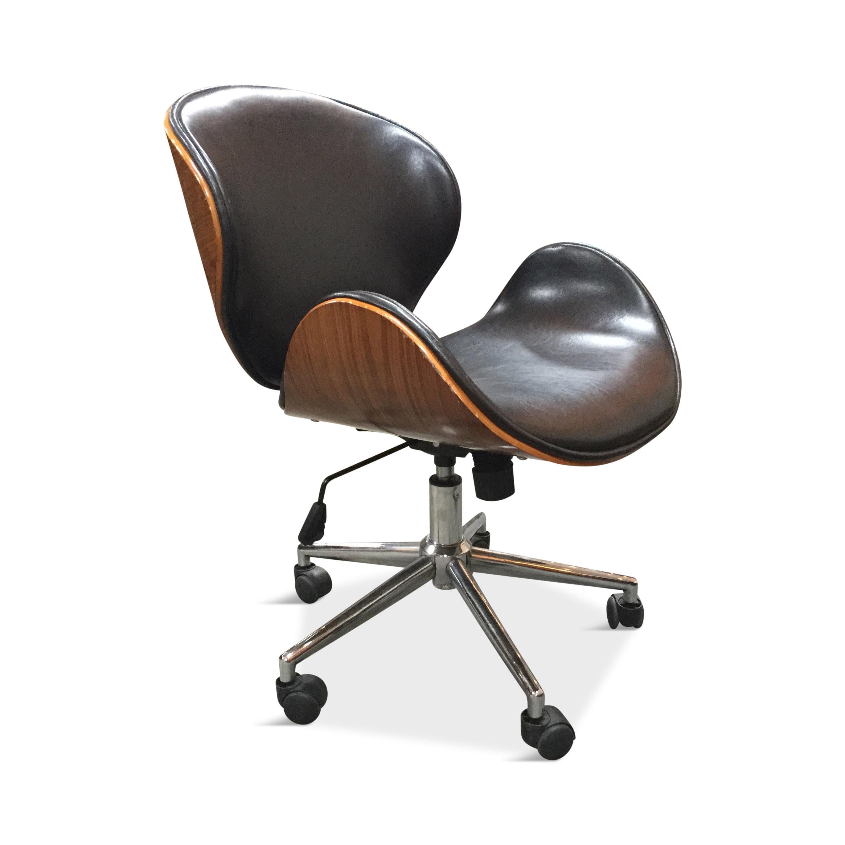 Modern office/task chair inspired by Arne Jacobsen's swan chair. Good vintage condition. Adjustable seat height. Black leather with molded plywood frame.
