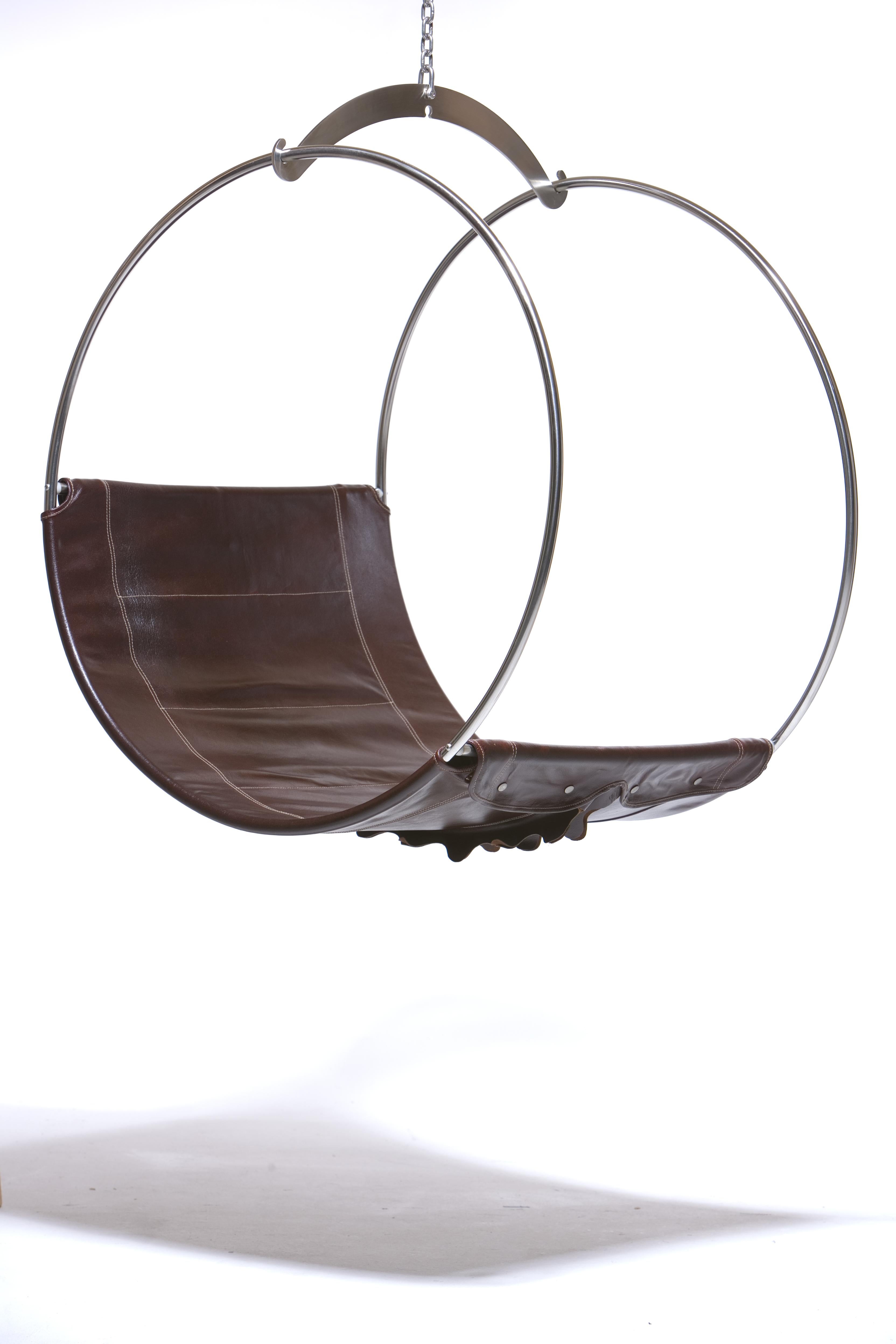 Leather Swing Chair by Egg Designs
Dimensions: 100 L X 80 D X 110 H cm 
Materials: Polished Stainless Steel, Leather

Founded by South Africans and life partners, Greg and Roche Dry - Egg is a unique perspective in contemporary furniture