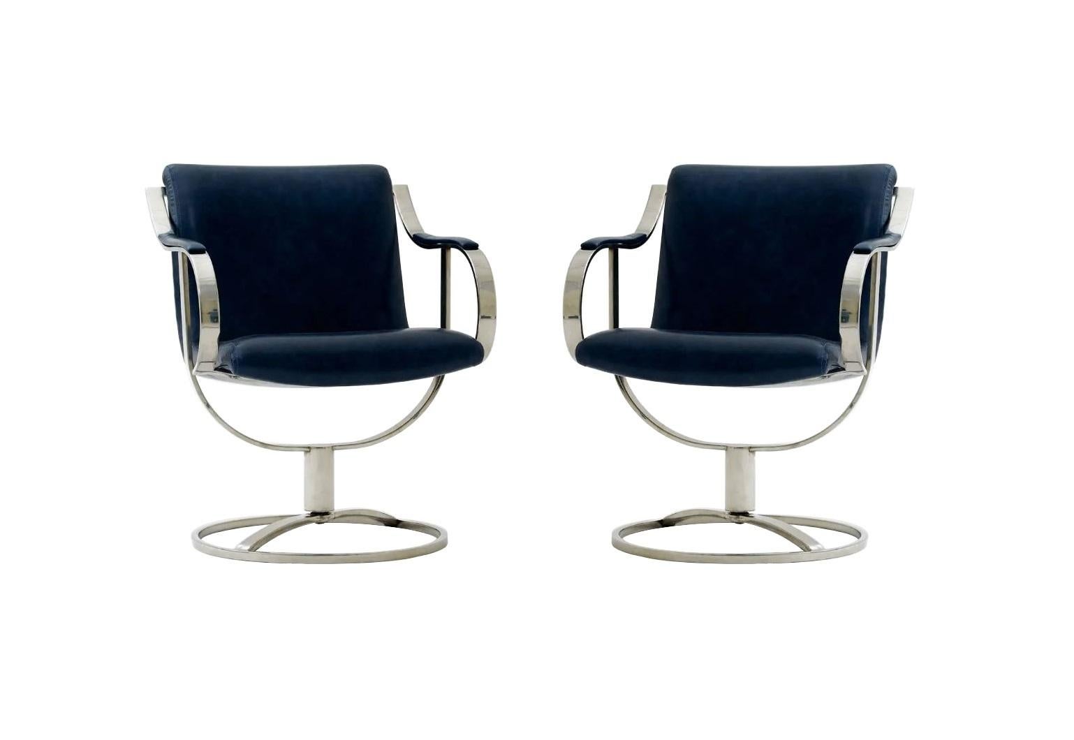 A pair of well constructed side/guest chairs model 455-211 designed by Gardner Leaver, manufactured by the Steelcase Furniture company. Refreshingly modern the bold, curved design and chrome-plated steel sculptural frames gives these swivel chairs a