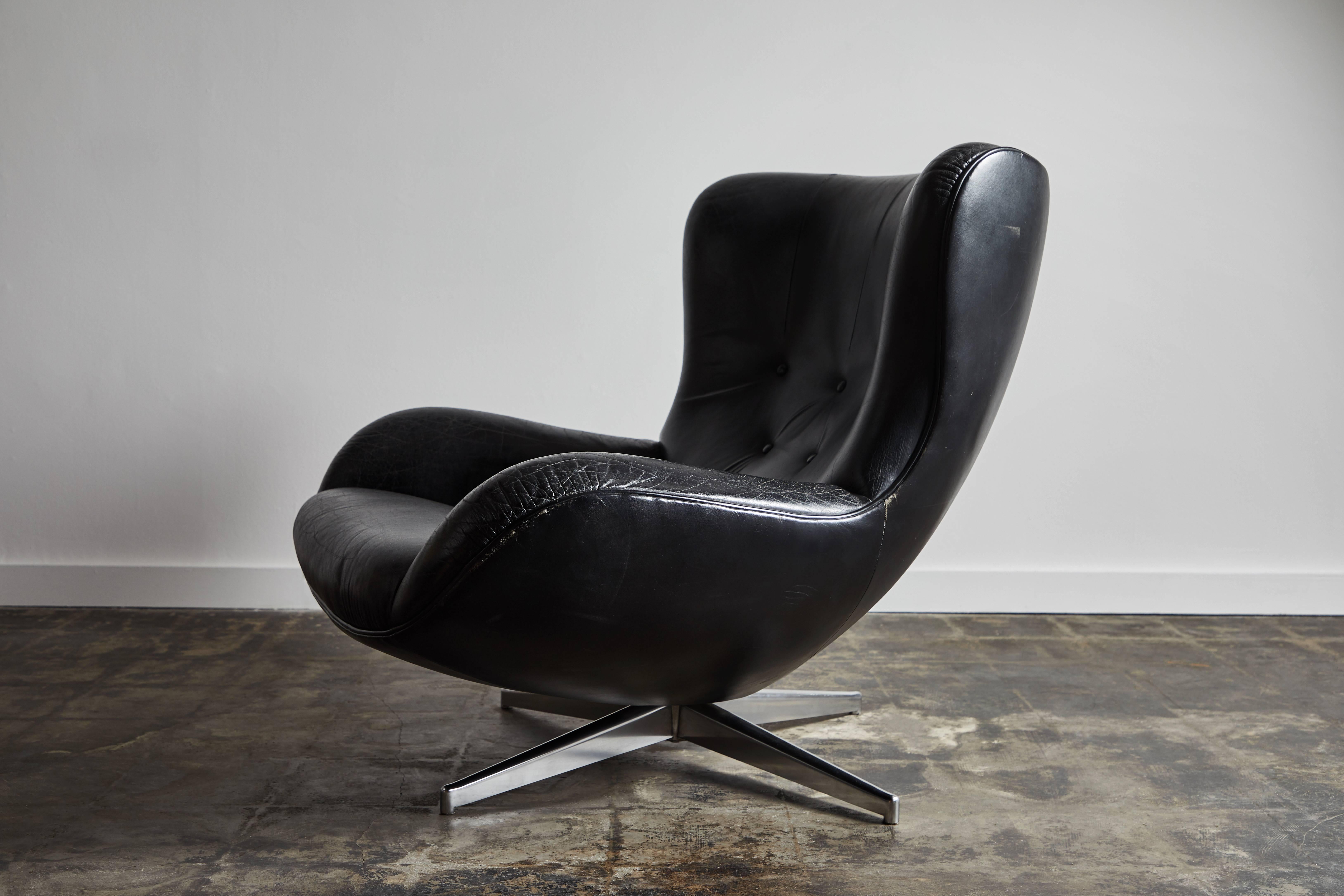 Mid-20th Century Leather Swivel Lounge Chair and Ottoman by Illum Wikkelsø