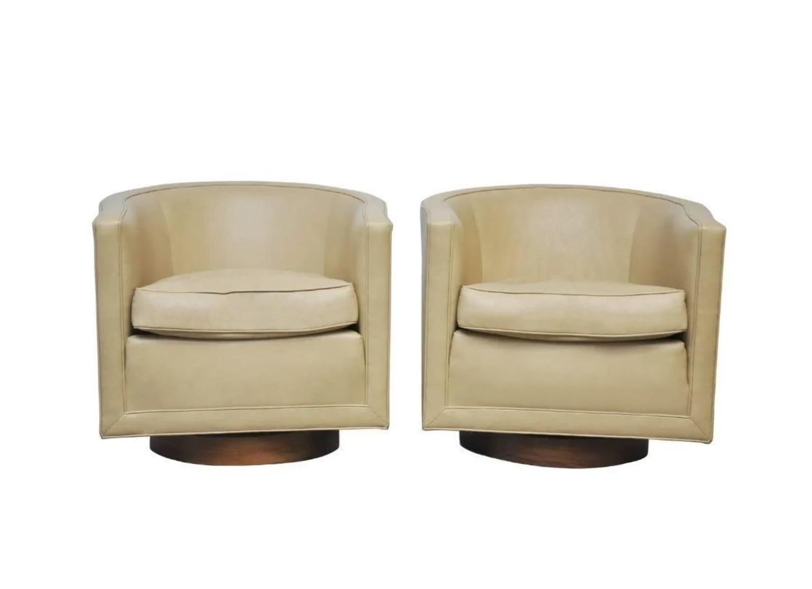 Add some playful elegance to your space with these swiveling Dunbar chairs designed by Edward Wormley, circa 1960's. His signature style, defined by clean lines and architectural simplicity, thoughtfully curated with great emphasis on comfort