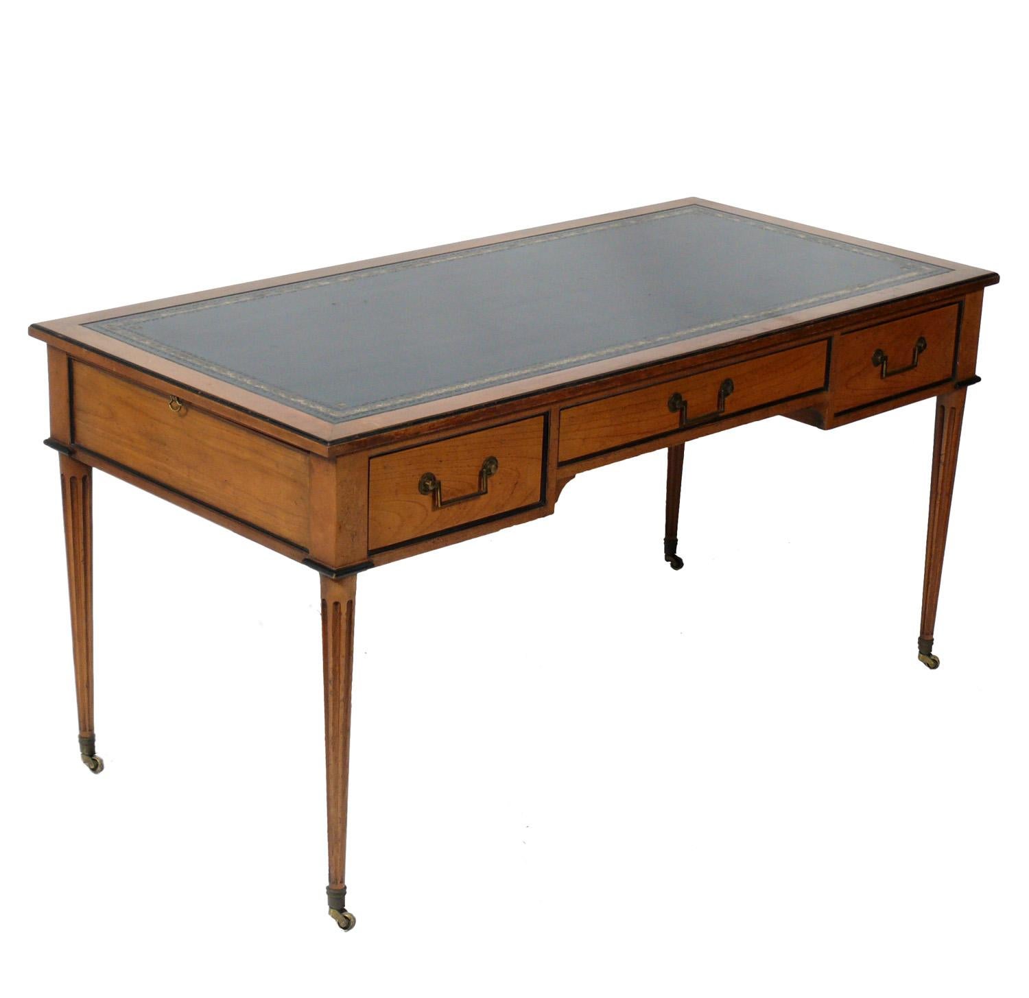 French style leather top Bureau plat or desk, made by Baker, American, circa 1960s. Retains wonderful original patina.