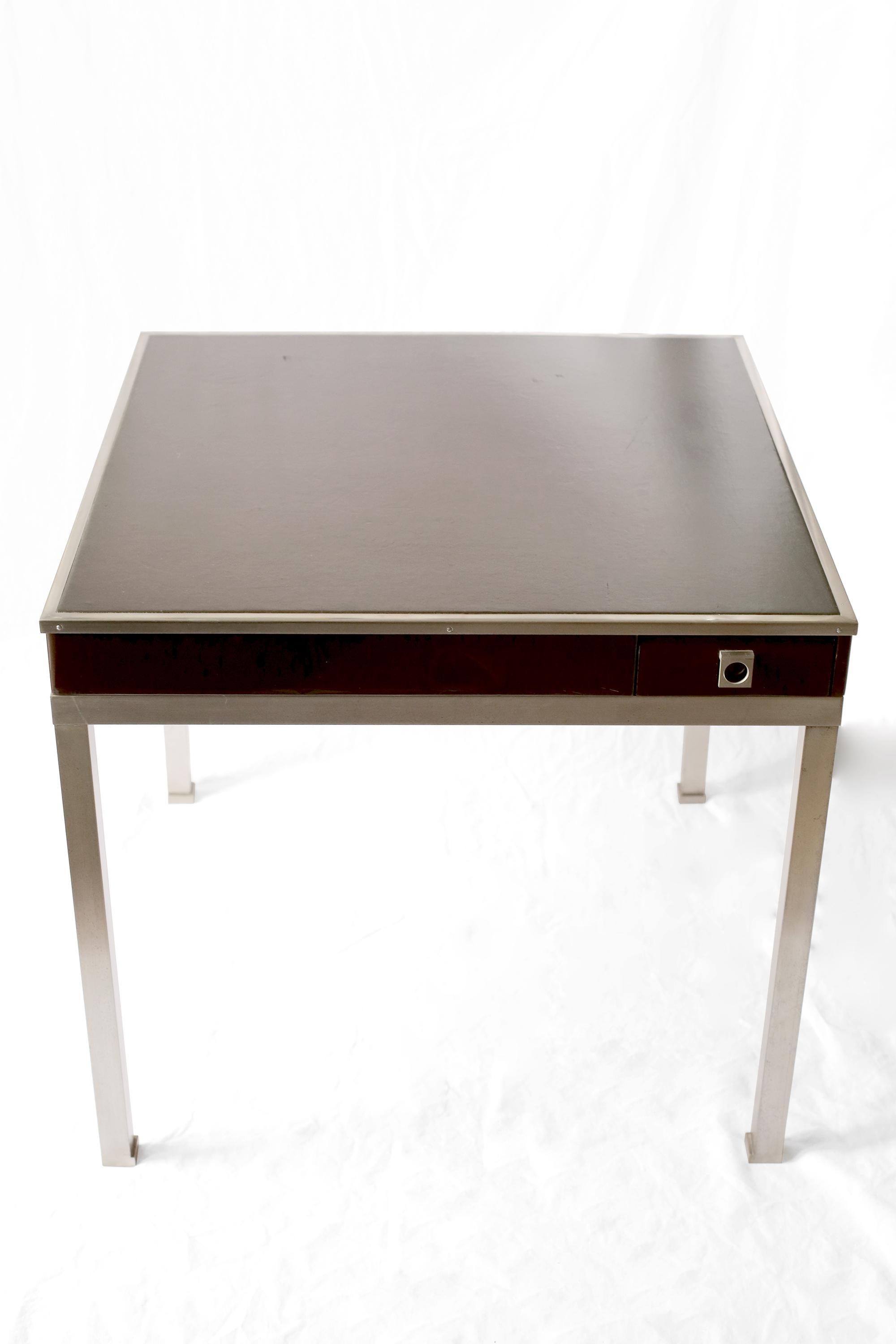 Brushed steel, chocolate brown lacquer and leather topped games table by Guy Lefevre for Maison Jansen. French, c. 1970s.