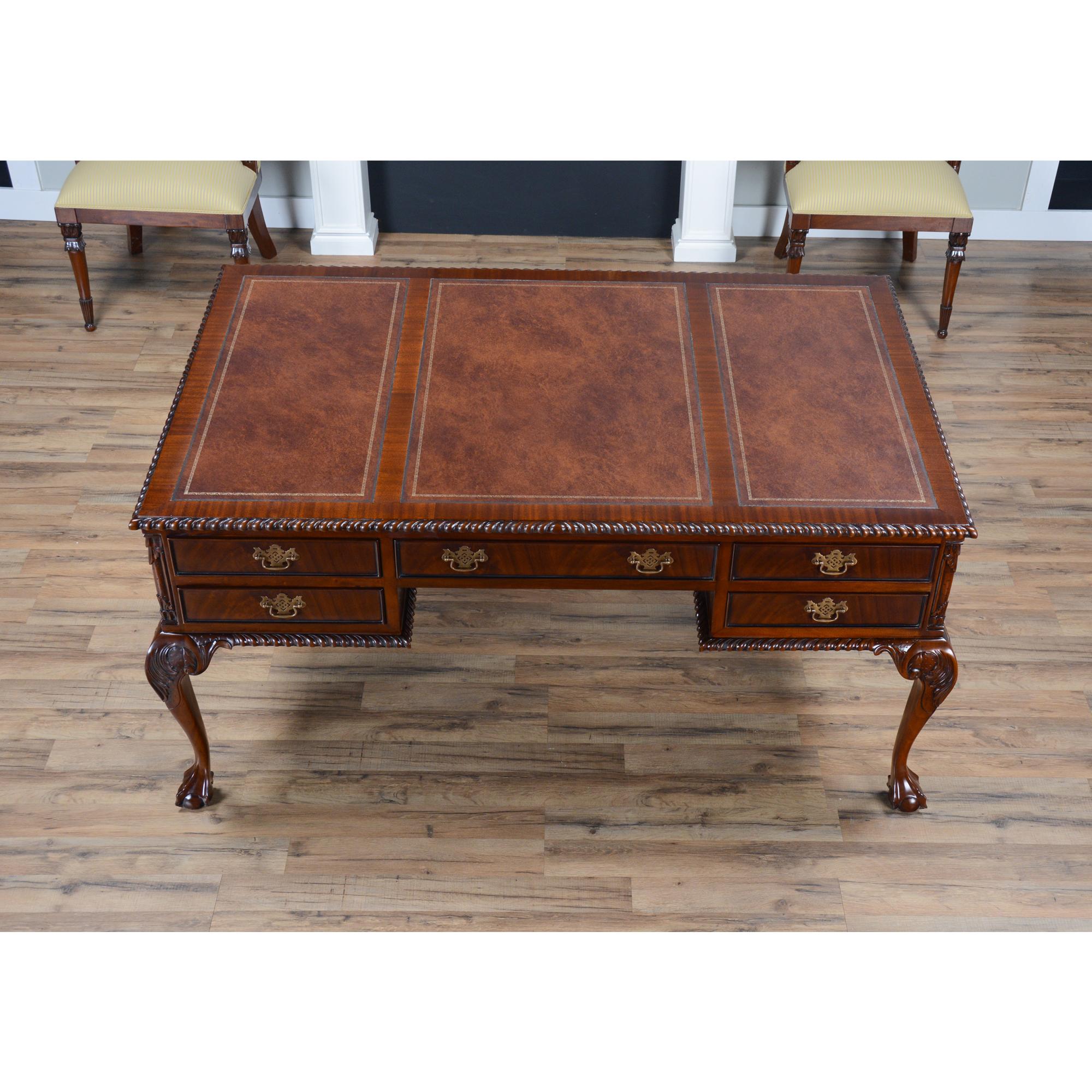 This is the Niagara Furniture version of the Leather Top Partner Desk. It is a true partner’s desk in every sense of the phrase with an equal number of drawers on each side of the desk. This Chippendale style high quality writing desk sets the