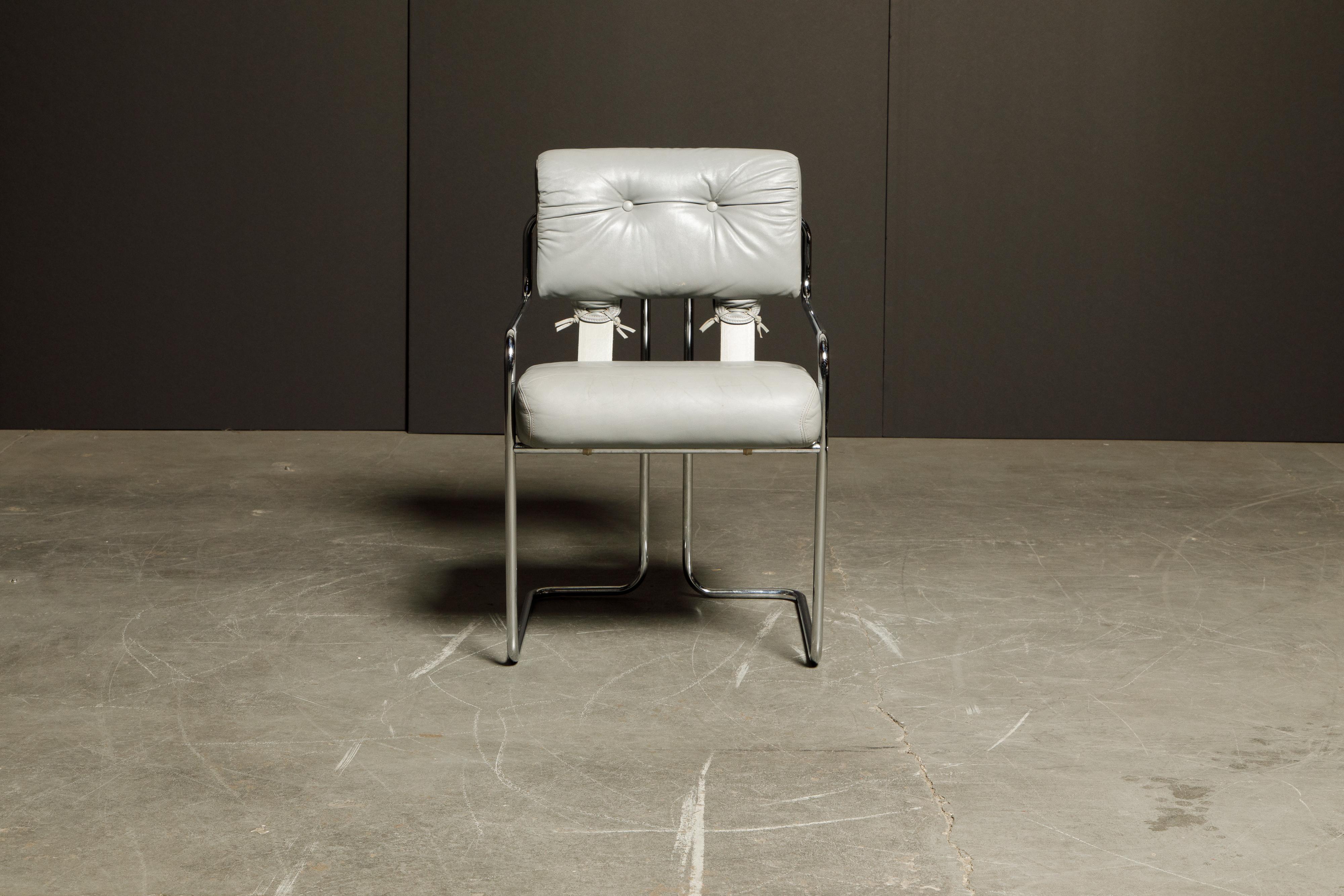 A beautiful Tucroma armchair by Guido Faleschini for i4 Mariani in beautiful light grey leather with polished chrome frame. The seat and back retains its original supple light gray leather upholstery and attached to graceful steel tubular frames, as