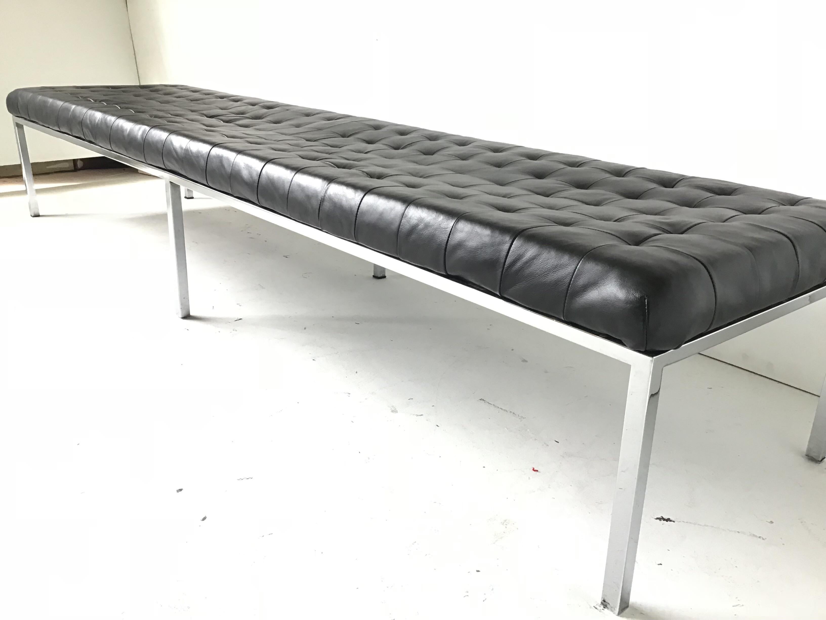 This is a vintage modern bench from circa 1970. It is manufactured by metropolitan. This bench is very similar to the Knoll benches. It has perfectly patinated black leather stitched in squares. The chrome is very clean. There is one hairline to the