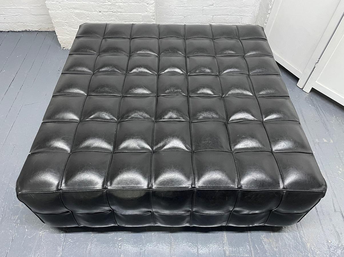 black leather tufted ottoman