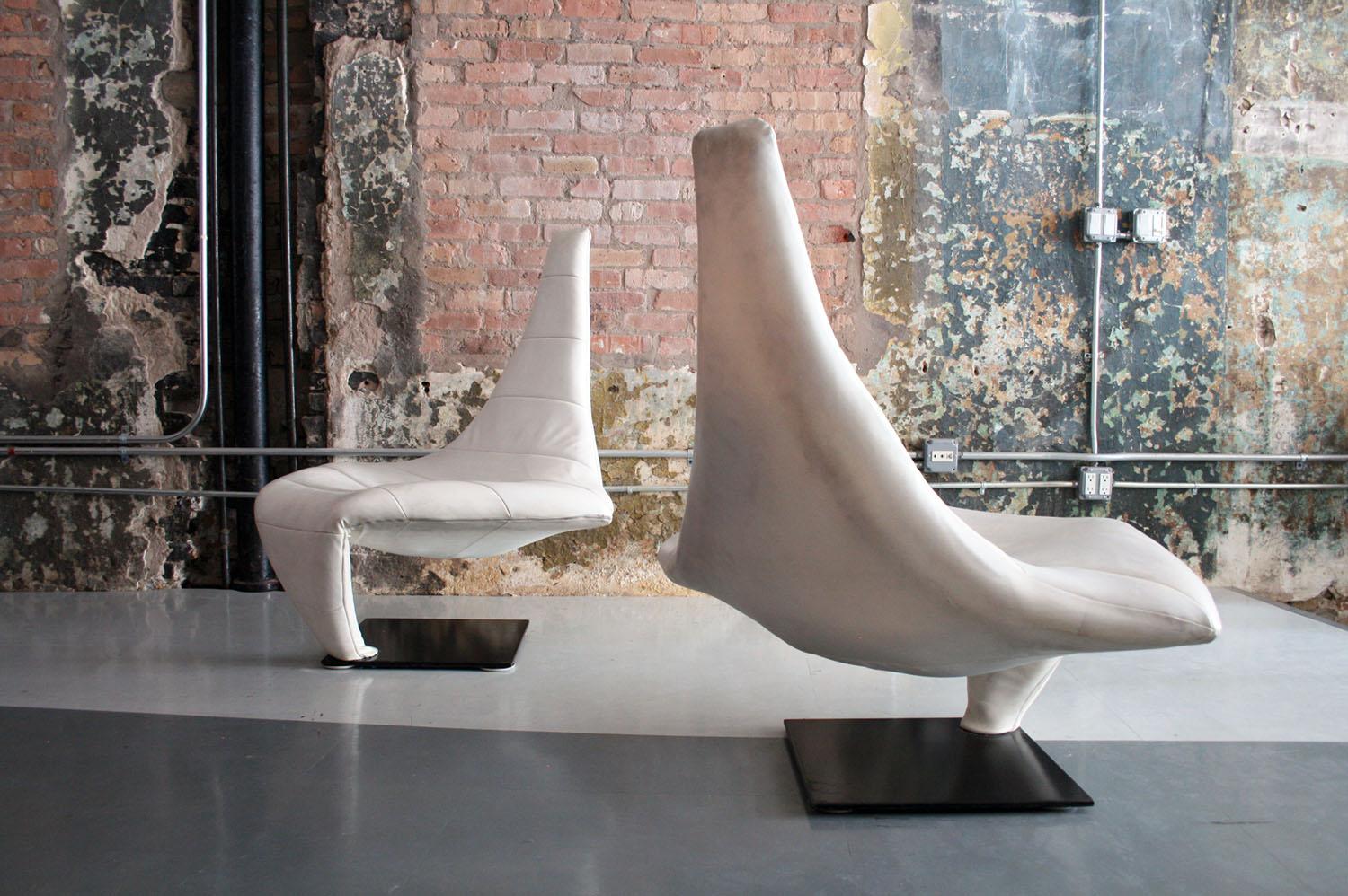 Beautiful sculptural white leather lounge chairs named Turner, and nicknamed 