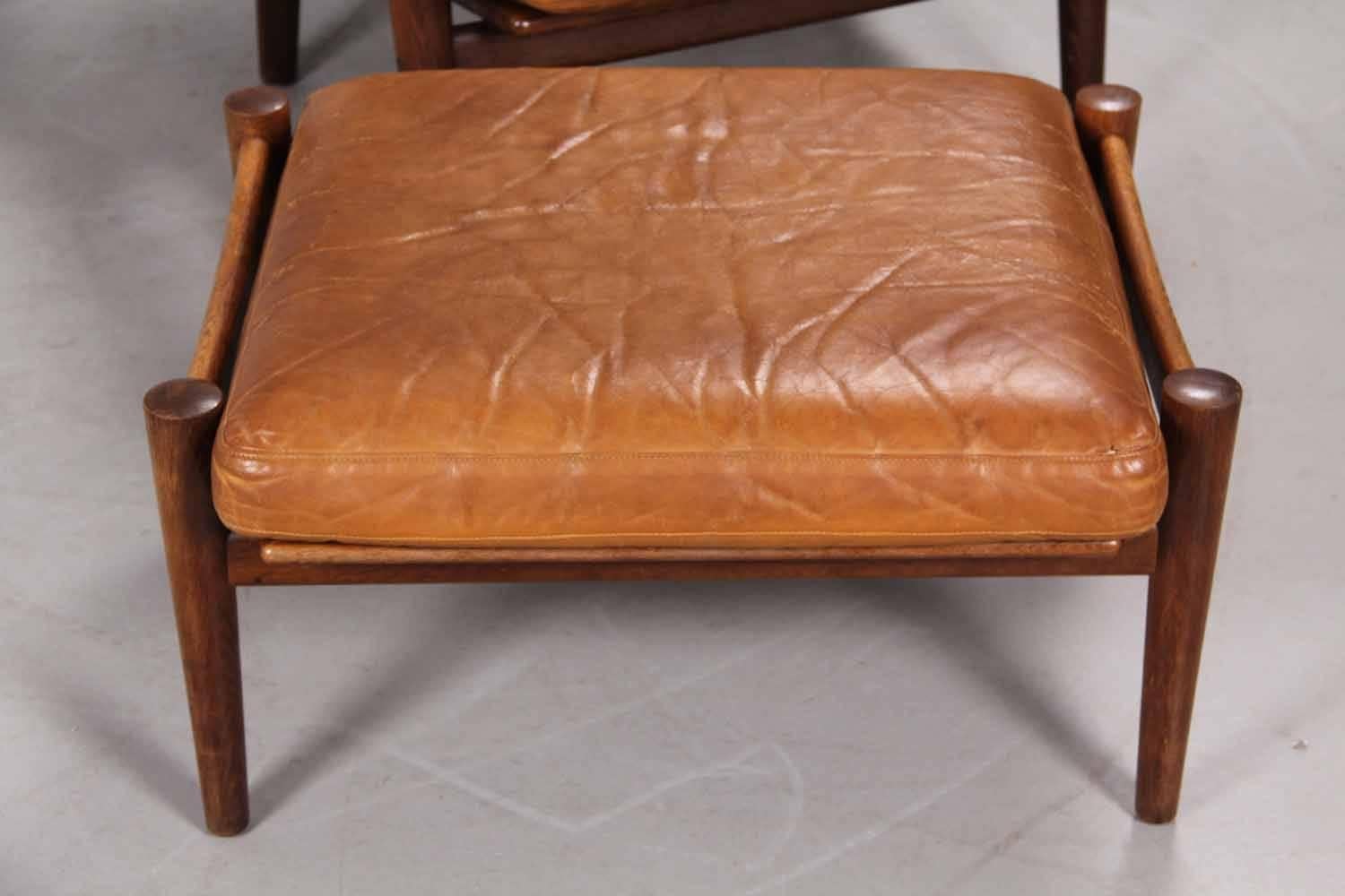 Scandinavian Modern Leather Upholstered Armchair and Ottoman by Hans Wegner
