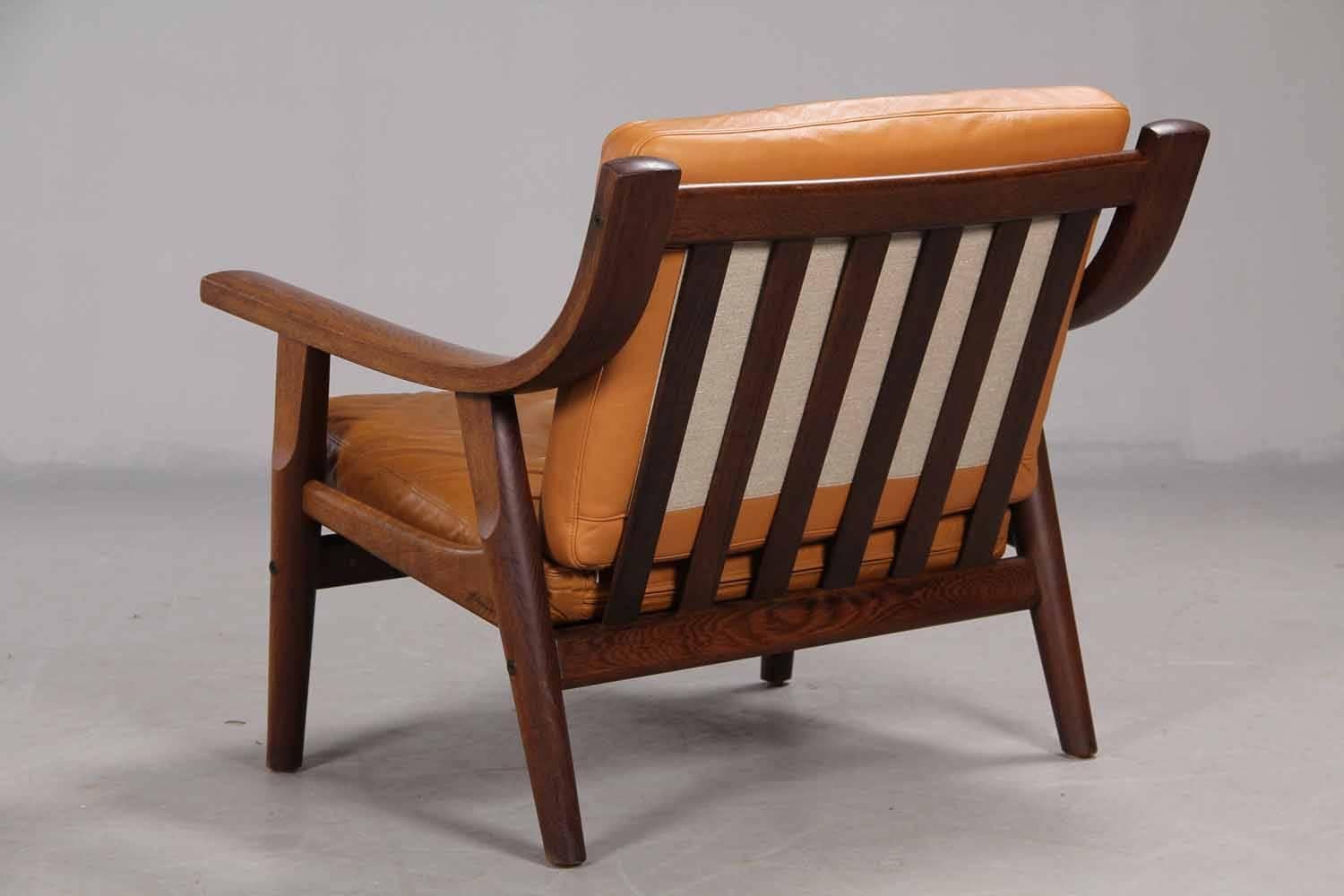 Danish Leather Upholstered Armchair by Hans Wegner