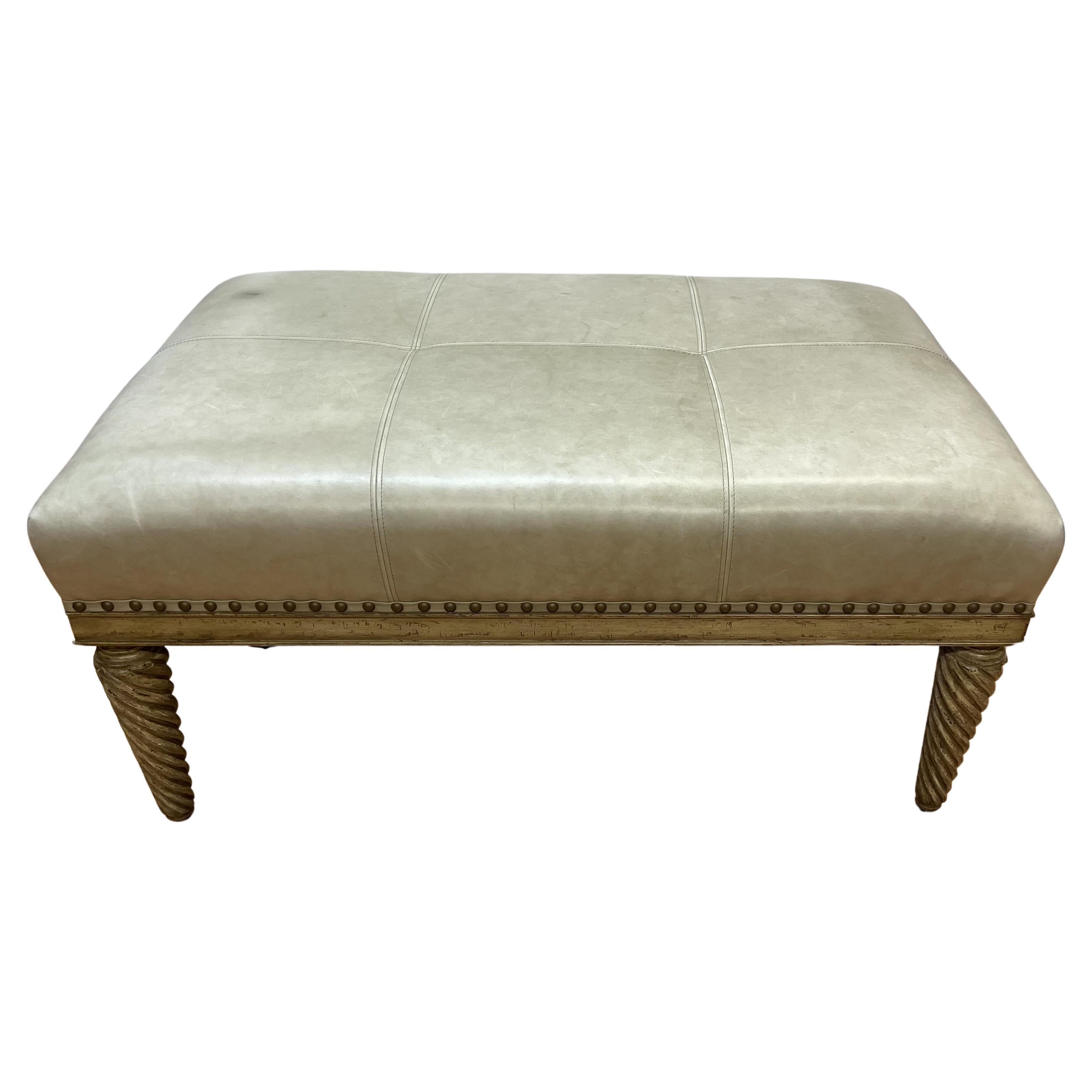 Leather upholstered bench with carved and painted turned legs 