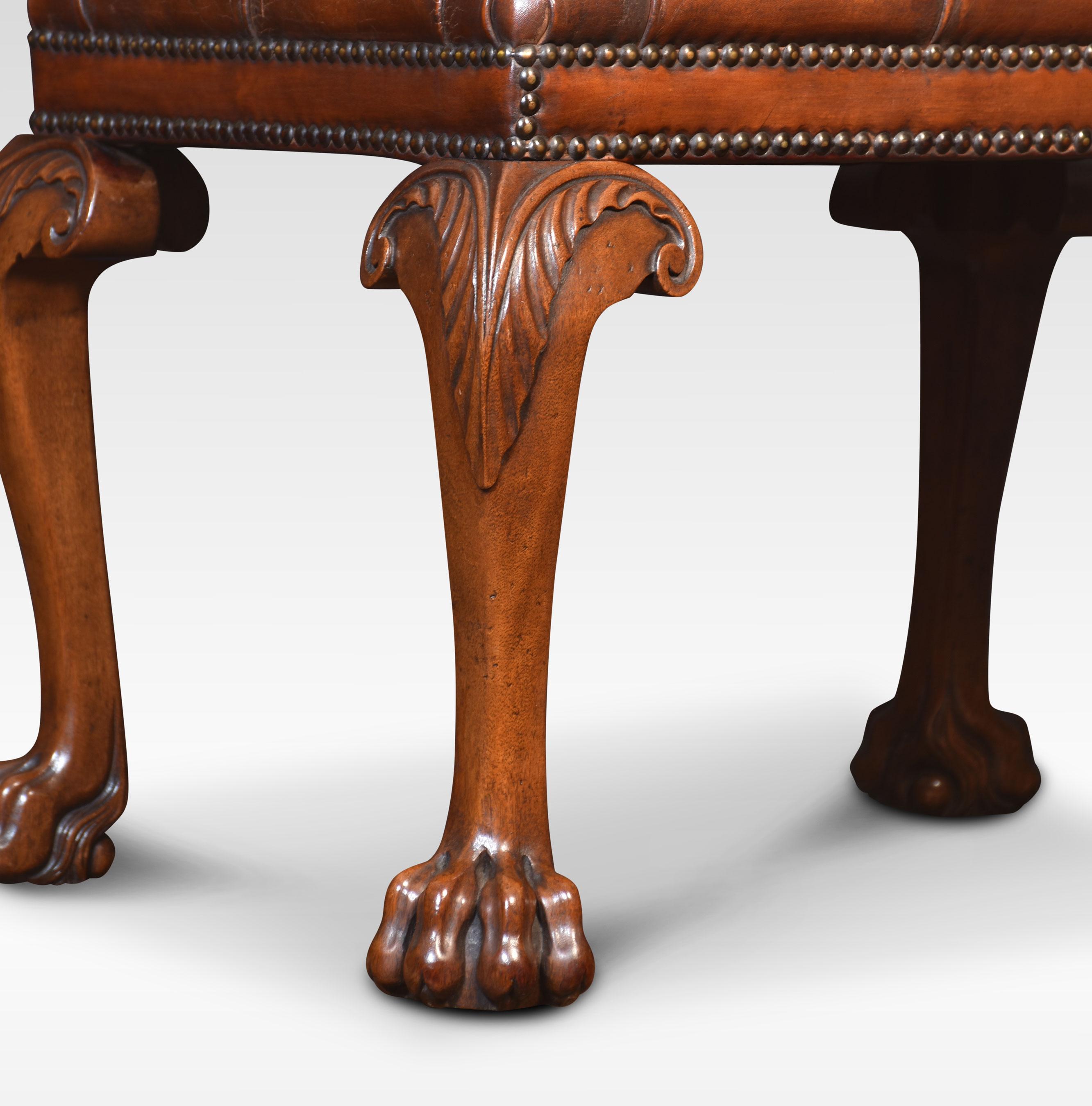 Carved stool, the rectangular upholstered brown leather deep buttoned seats raised up on four carved cabriole legs terminating in paw feet. The leather has been replaced and hand-dyed.
Dimensions
Height 18 Inches
Width 24.5 Inches
Depth 18.5