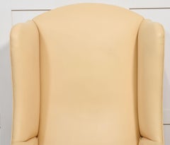 Leather upholstered wingback armchair