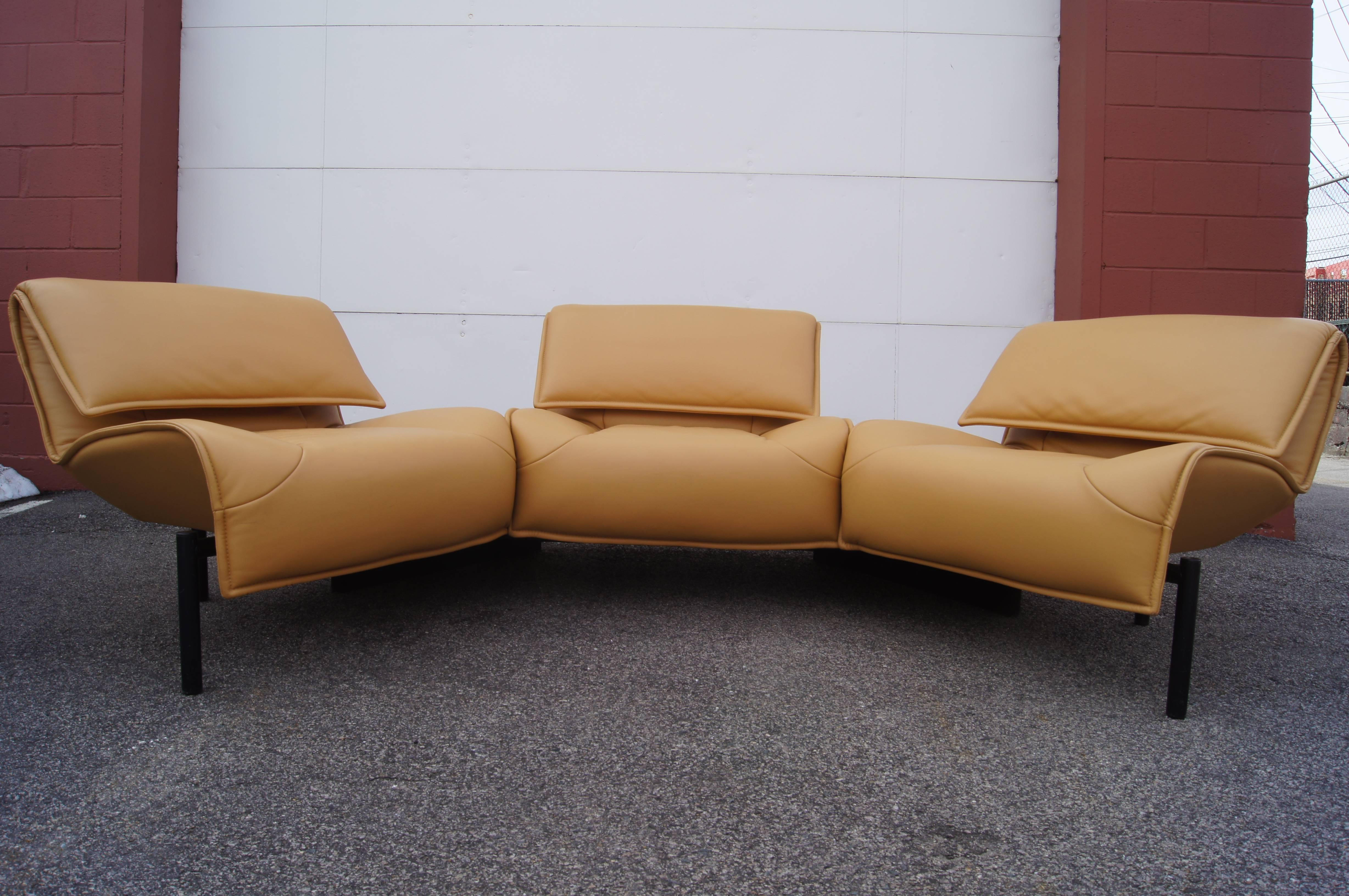 Designed by Vico Magistretti and produced by Cassina in 1984, the Veranda 3 sofa comprises three connected lounge chairs. The two at the end swivel on their fixed base to form a more intimate configuration. Each supple beige-colored leather seat has