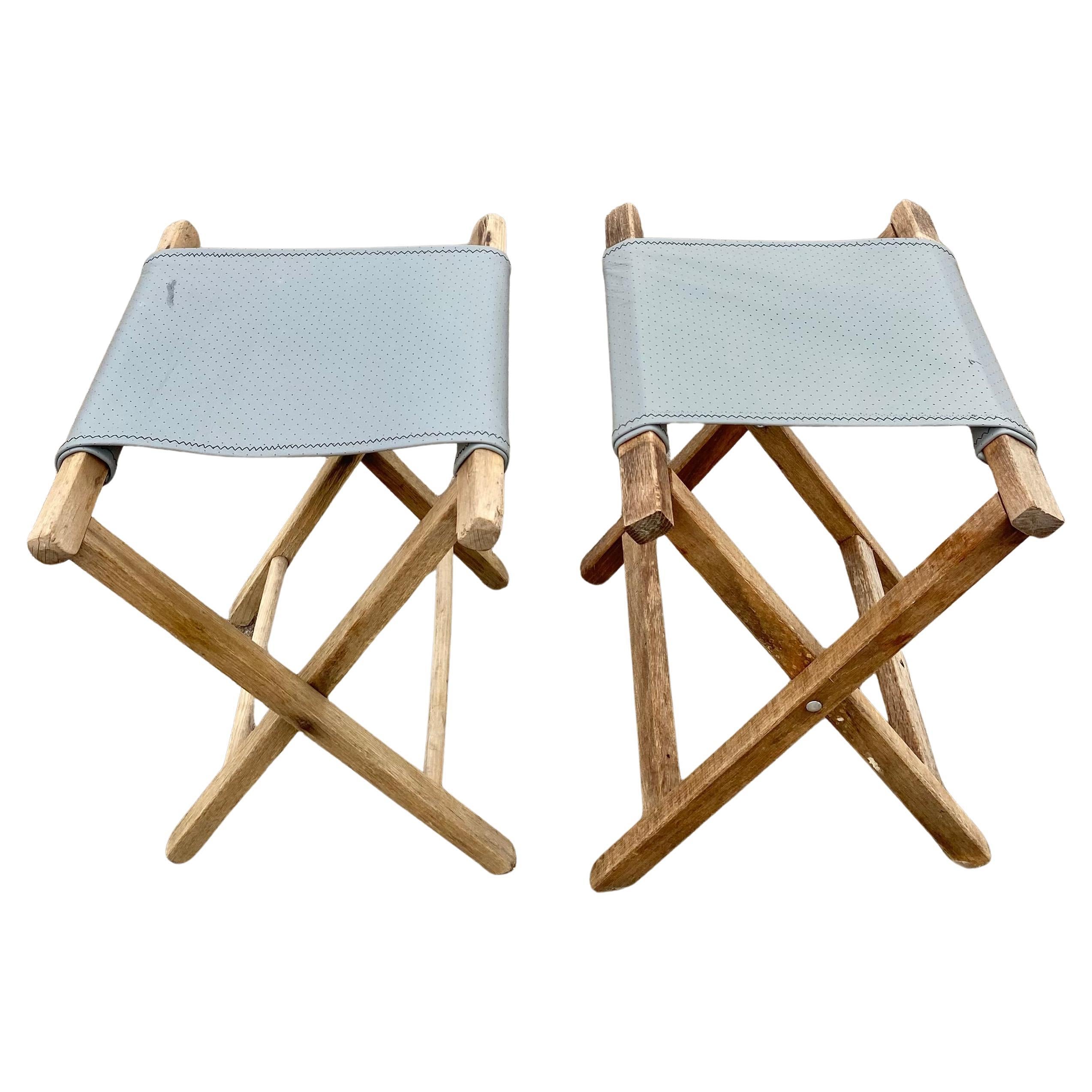 A pair of refurbished and re-imagined vintage, 1950s folding camp stools. 

New perforated 