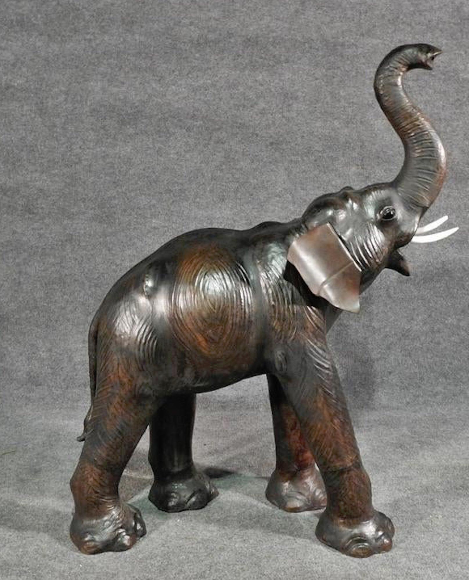Vintage sculpted elephant wrapped in aged leather. Missing tusks.
(Please confirm item location - NY or NJ - with dealer).
 