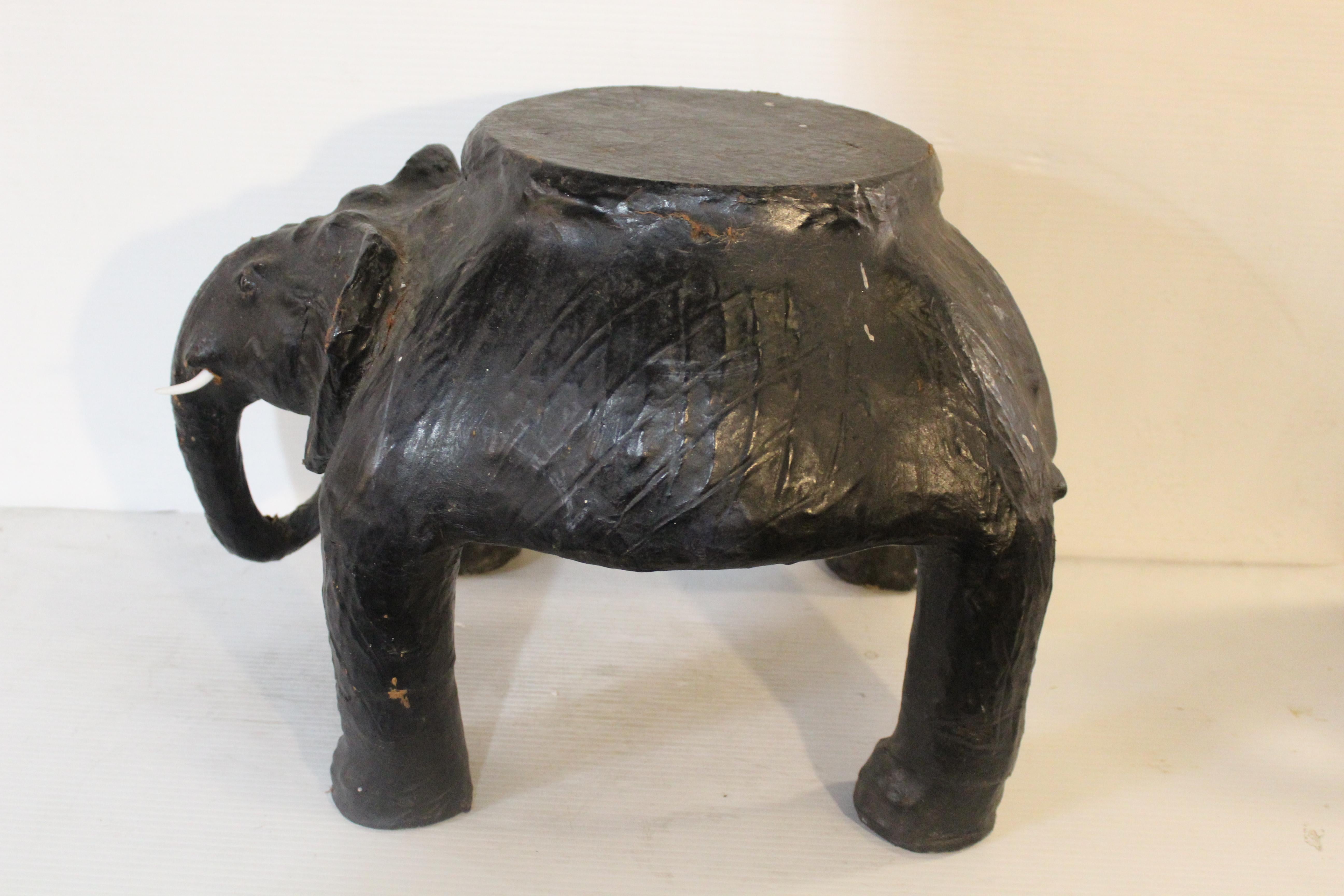 Unique table or plant stand made of aged leather wrapped around a sculpted elephant form. Complete with tusks and eyes.
Please confirm location NY or NJ