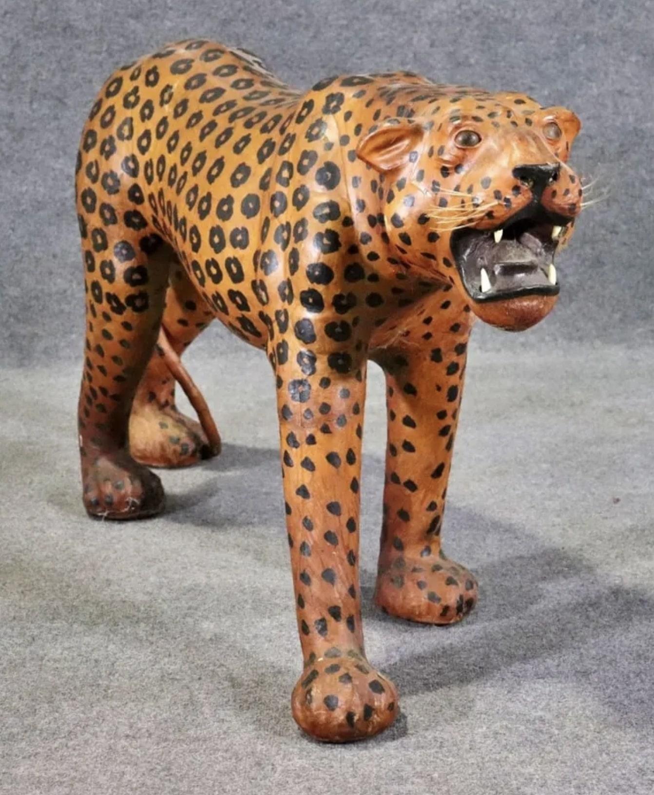 Beautiful standing leopard sculpture in leather. Painted with an orange and black spotted pattern. Great detailing to face and teeth.
Please confirm location NY or NJ