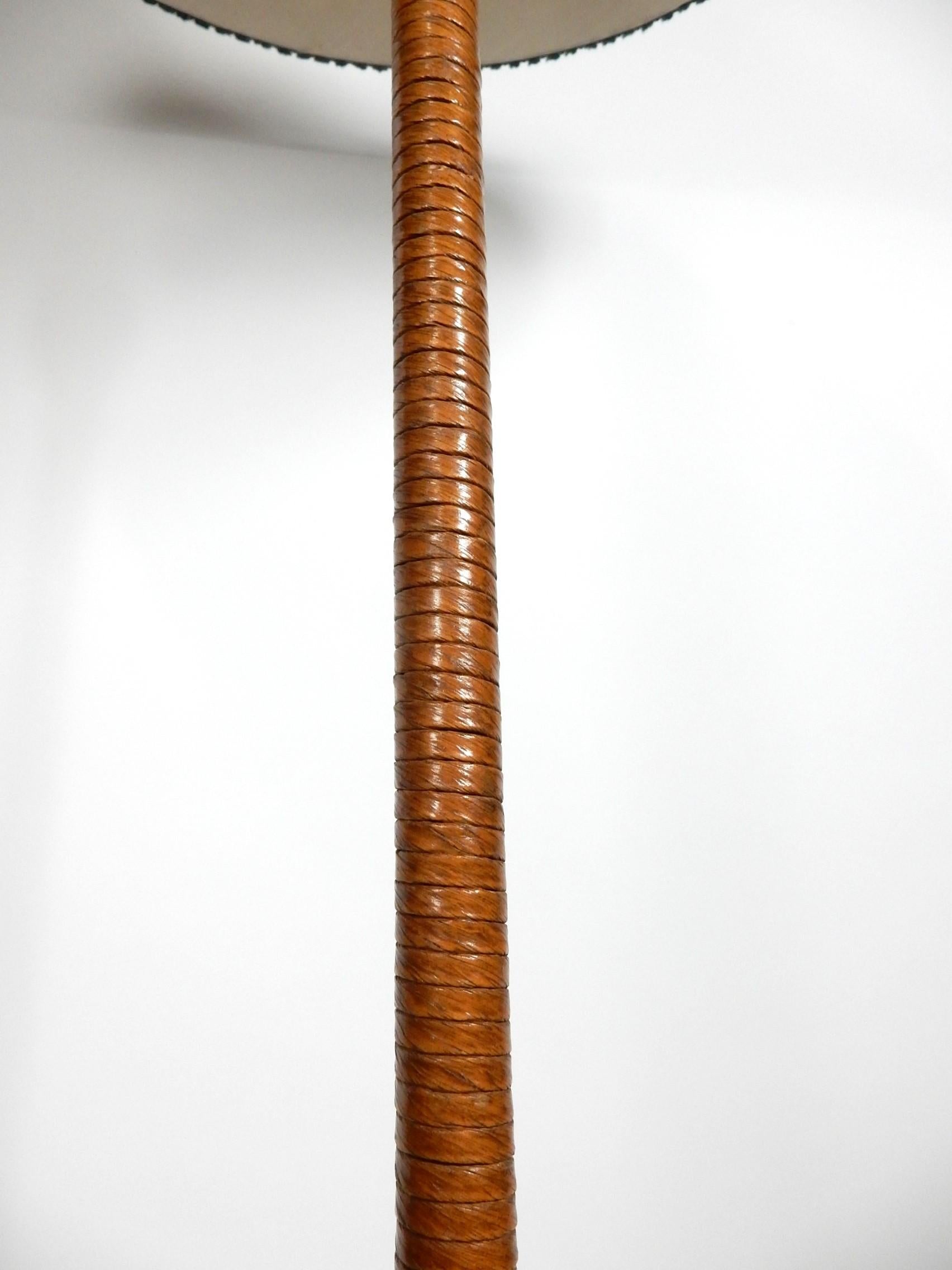 Spectacular Oak floor lamp with wrapped leather shaft and 
fine Hemp cord on base.
Golden Oak color tones. Original 