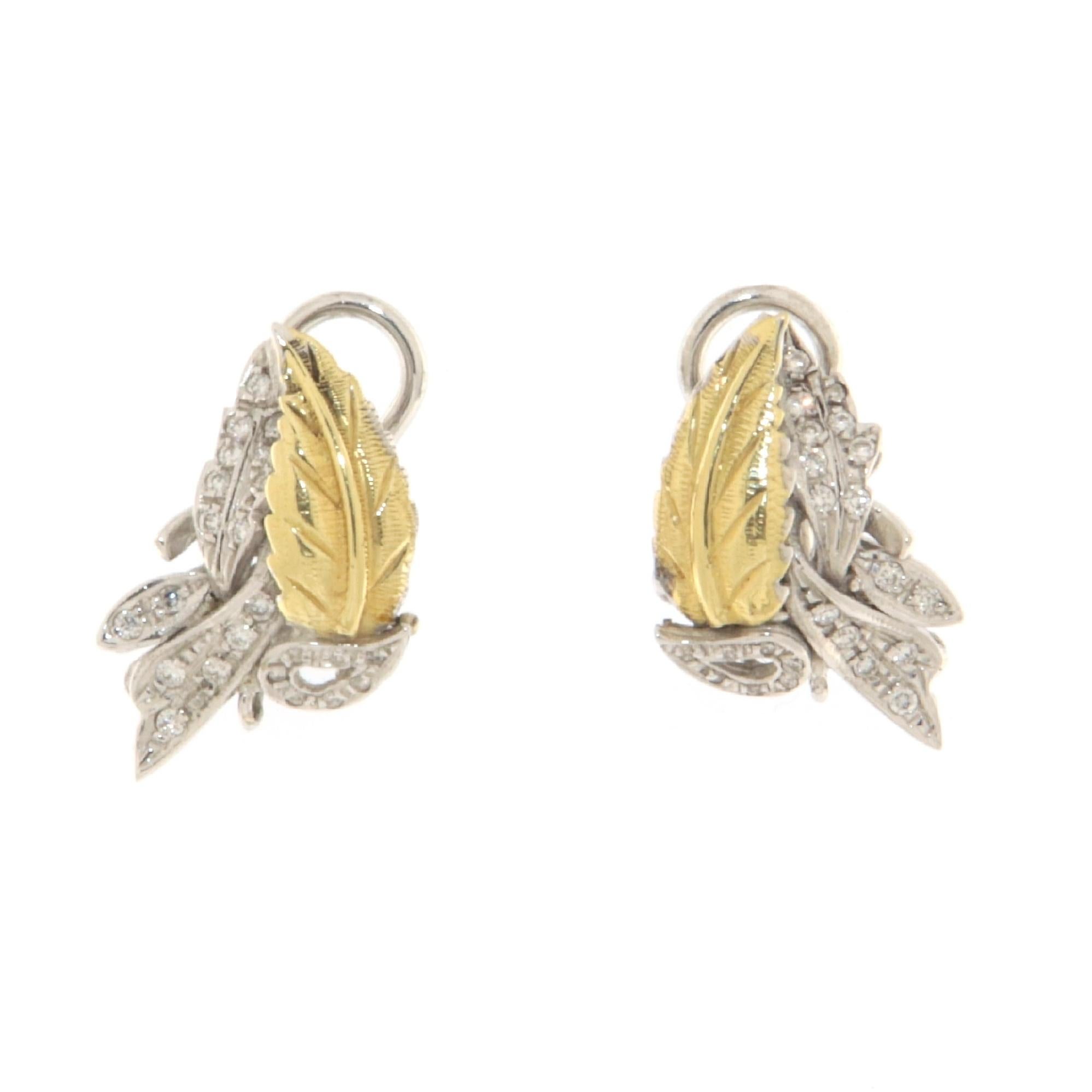 These sophisticated leaf-shaped earrings, crafted in a stunning blend of 18-karat white and yellow gold, are a tribute to the eternal beauty of nature, finished with a touch of modern luxury. The fusion of white and yellow gold creates an