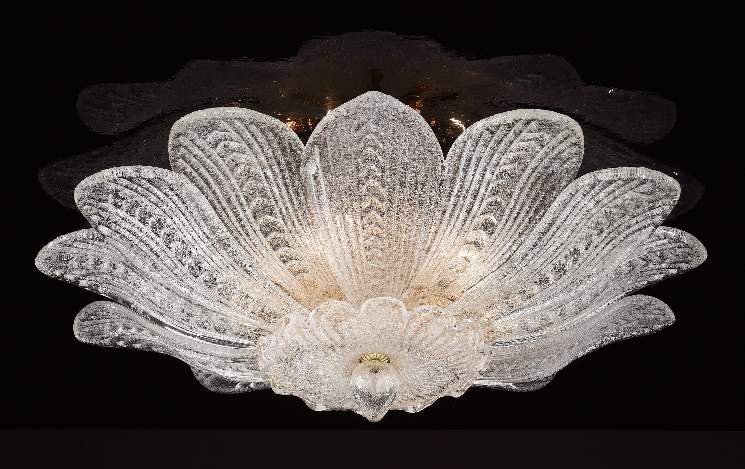 Italian flush mount with clear Murano glass leaves hand blown in Graniglia technique to produce granular textured effect, mounted on 24 K gold plated finish metal frame by Fabio Ltd / Made in Italy
3 lights / E26 or E27 type / max 60W each
Measures: