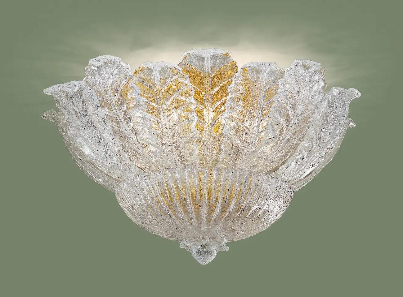 Italian flush mount with clear Murano glass leaves hand blown in Graniglia technique to produce granular textured effect, mounted on 24 K gold plated finish metal frame / Made in Italy in the style of Barovier e Toso
6 lights / E12 or E14 type / max