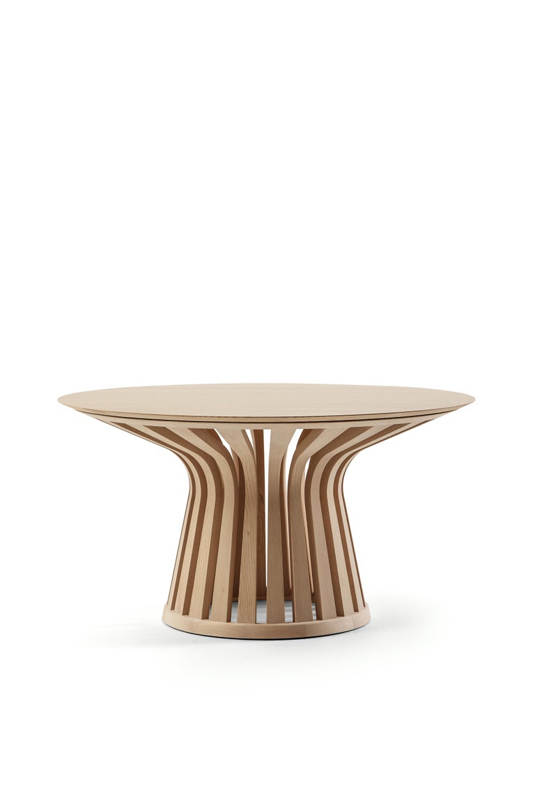 Lebeau wood table by Patrick Jouin 
Manufactured by Cassina in Italy

Lebeau Wood is an evolution of the iconic and innovative Lebeau table. While the original's dimensions and outline are maintained, solid wood becomes the material of choice for
