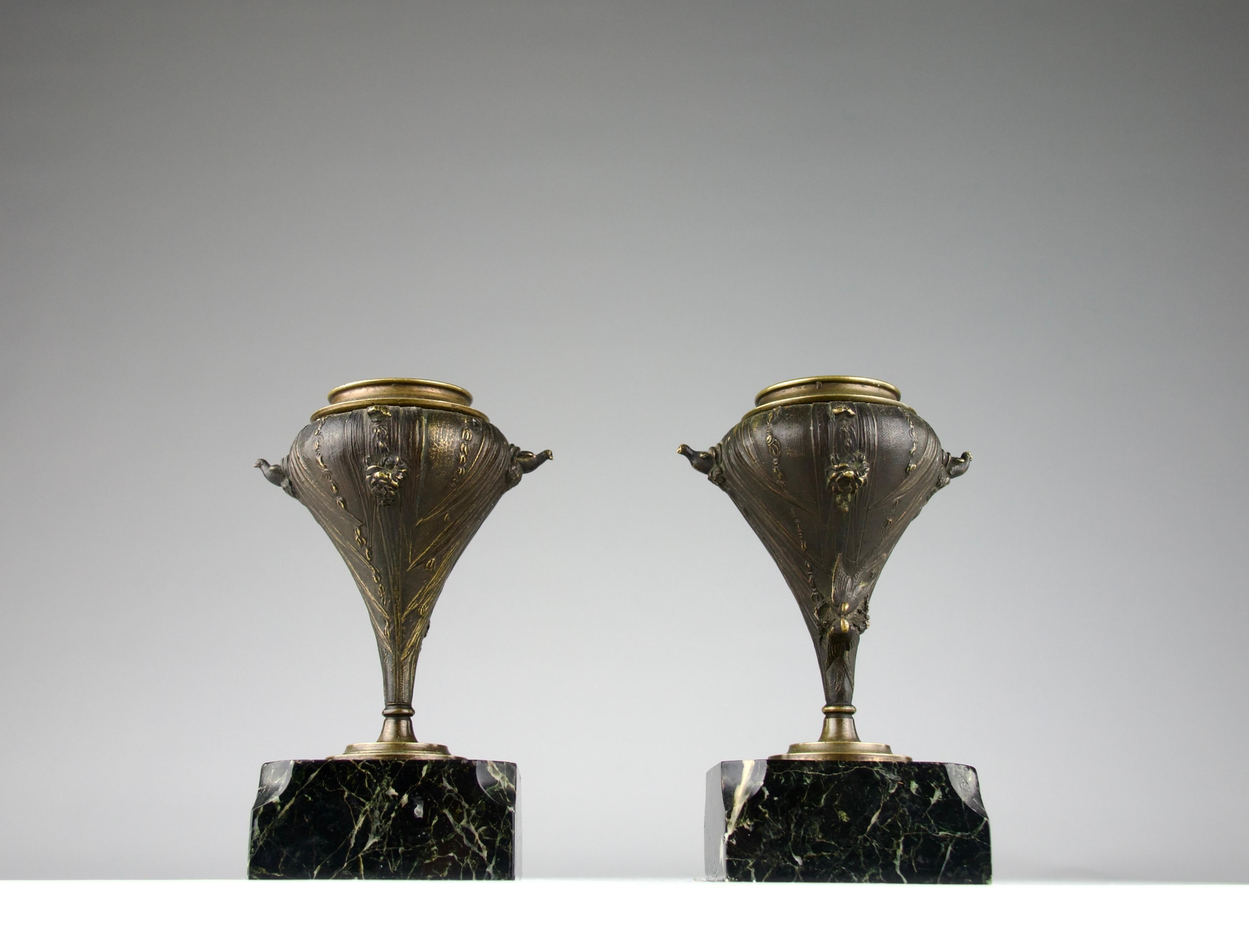 Superb art deco candleholders by LeBlanc Barbedienne. Beautiful and intricate decorations of pigeons and swallows. In bronze and Portor black and white veined marble. France, Late 1800s. Signed LeBlanc.

In good condition, oxidation, small chips