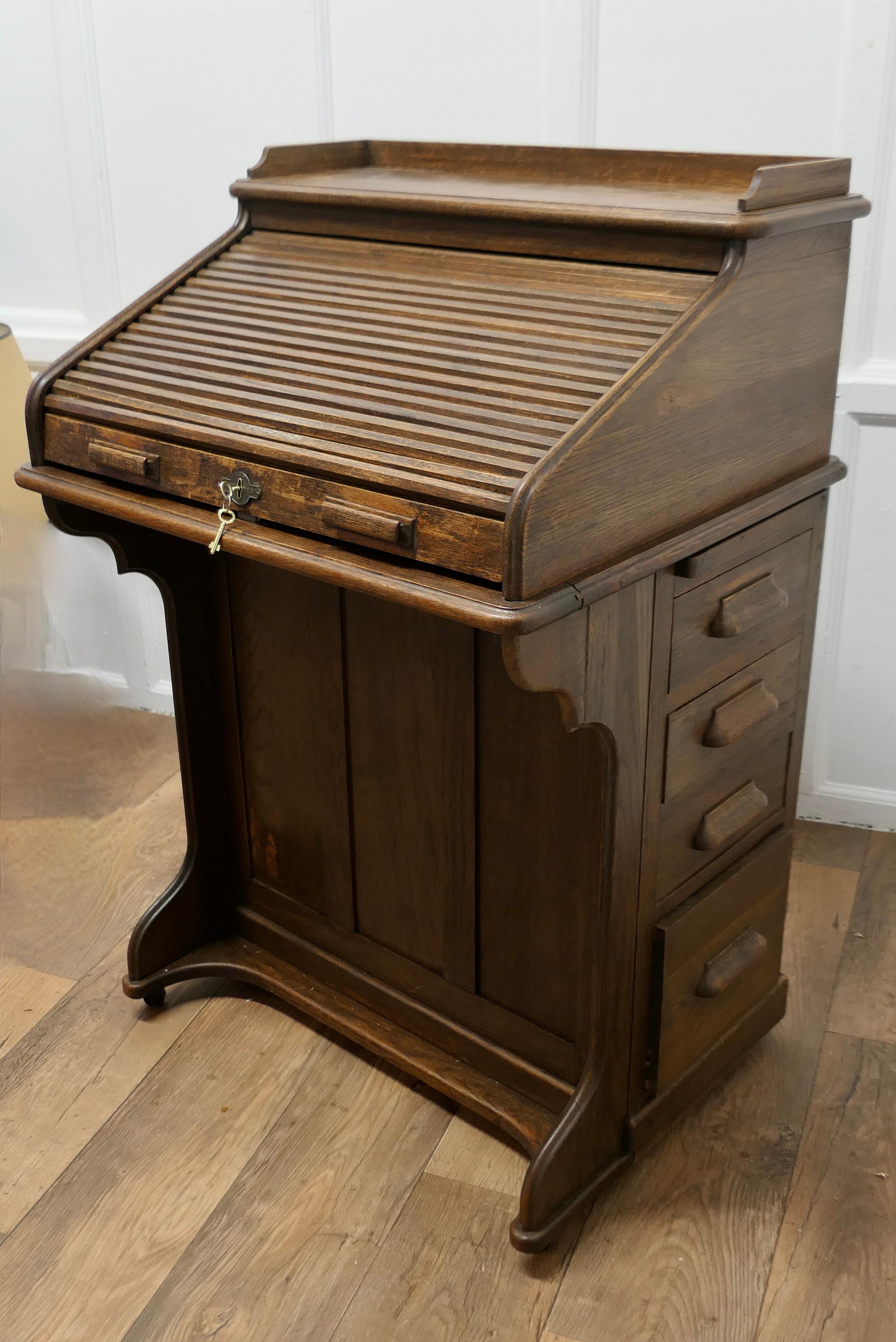 Lebus Art Deco Oak, Restaurant Roll Top Desk Greeter  

This Oak restaurant greeting station which is made by Lebus, has roll top tambour which conceals beneath it a fitted interior of pigeon holes, card index drawers and stationary compartments
It