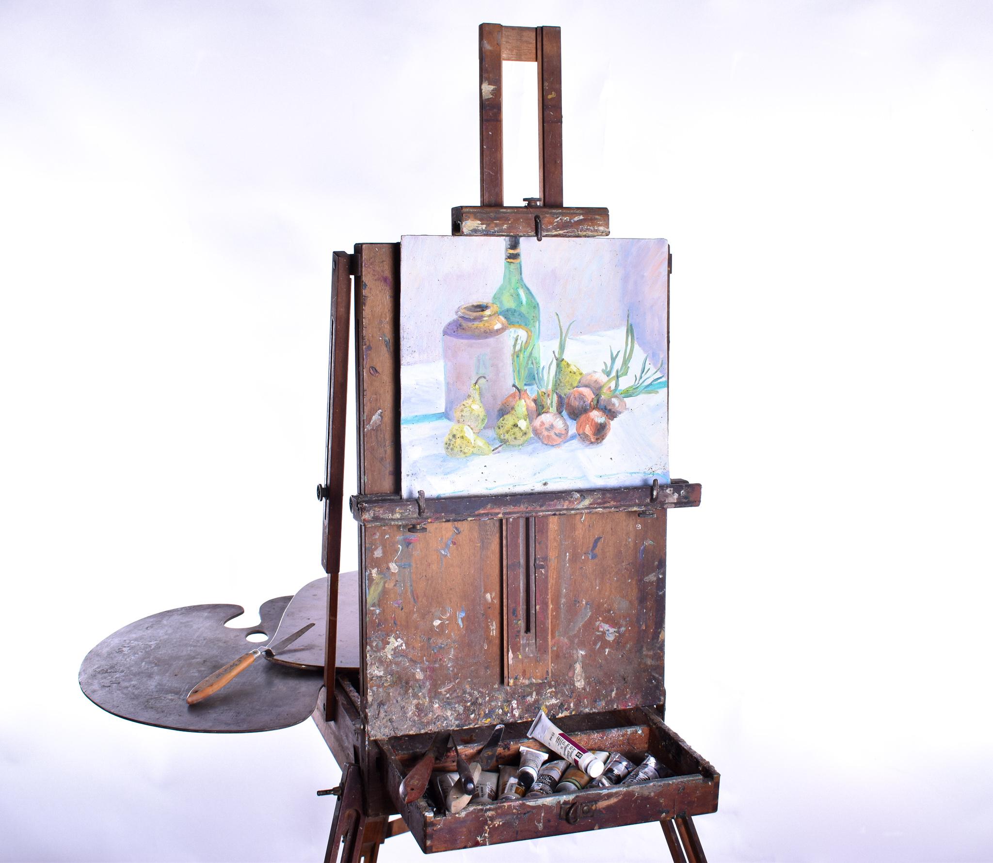 An original antique Lechertier Barbe folding travel easel.

An extremely striking and well made piece, its normal form is that of a briefcase sized piece of luggage, unfolded you have a generous work station, there is a sliding tray for paints
