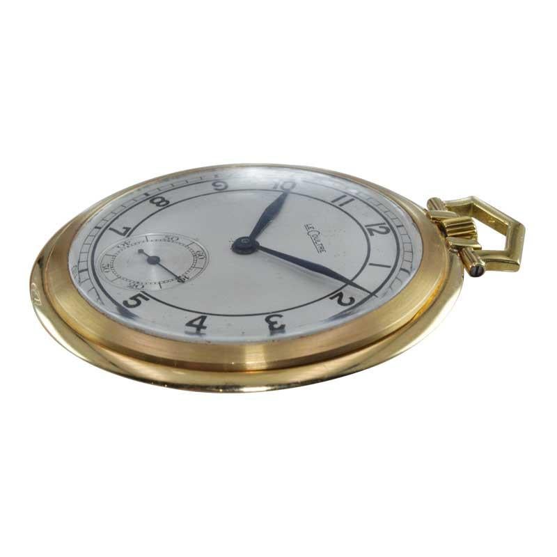 FACTORY / HOUSE: LeCoultre
STYLE / REFERENCE: Open Face Pocket Watch
METAL / MATERIAL: 18K Yellow Gold
CIRCA / YEAR: Late 1940's
DIMENSIONS / SIZE: Diameter 48mm
MOVEMENT / CALIBER: Manual Winding / 15 Jewels 
DIAL / HANDS: Original Silver Dial /