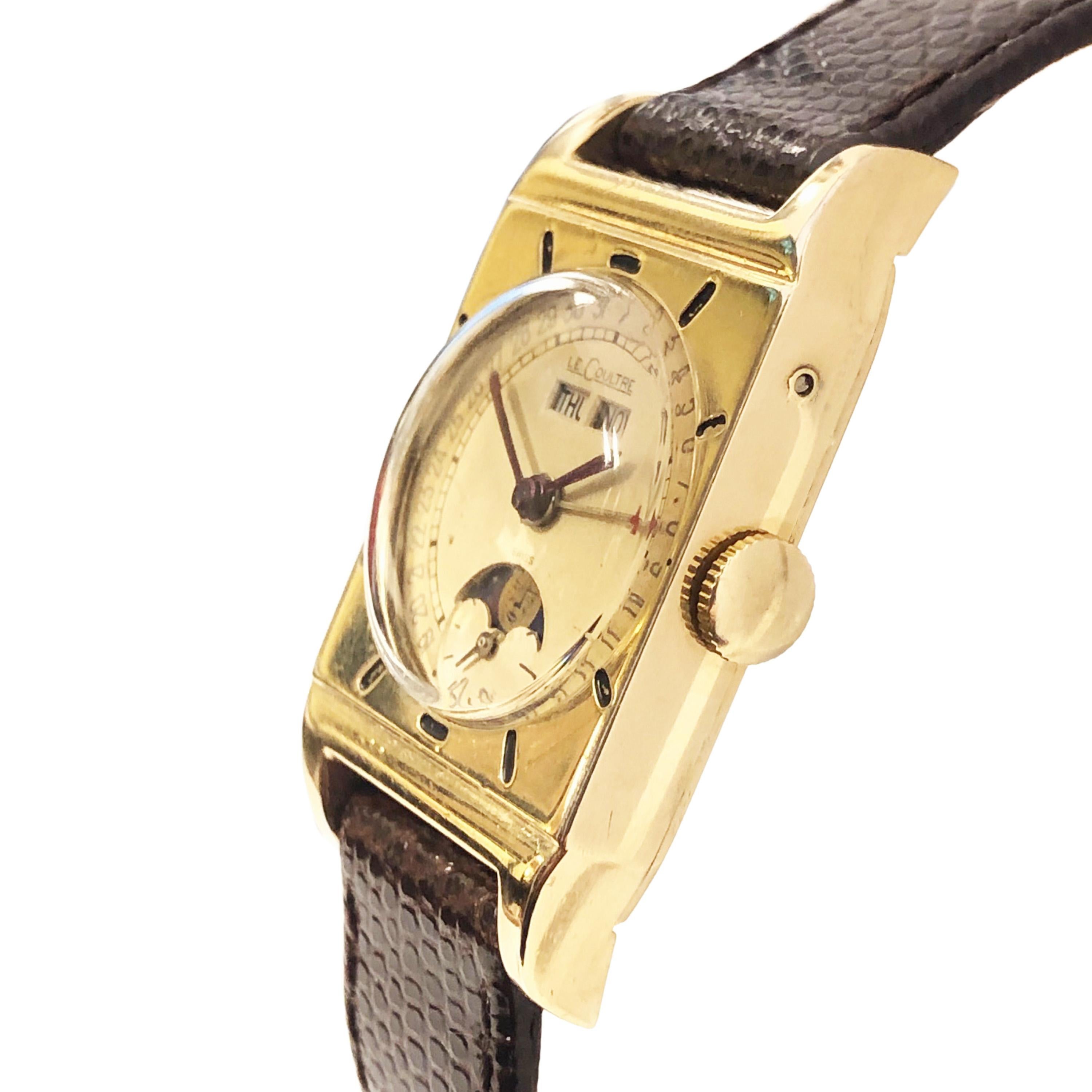 Circa 1940s LeCoultre Wrist Watch, 40 X 23 MM and 7 MM thick Gold Filled 2 Piece case. 17 Jewel Mechanical, Manual wind movement, Original 2 Tone White Cream Dial with outer track, Sub Seconds, Moonphase and Day Date Calendar. New Hirsch Brown