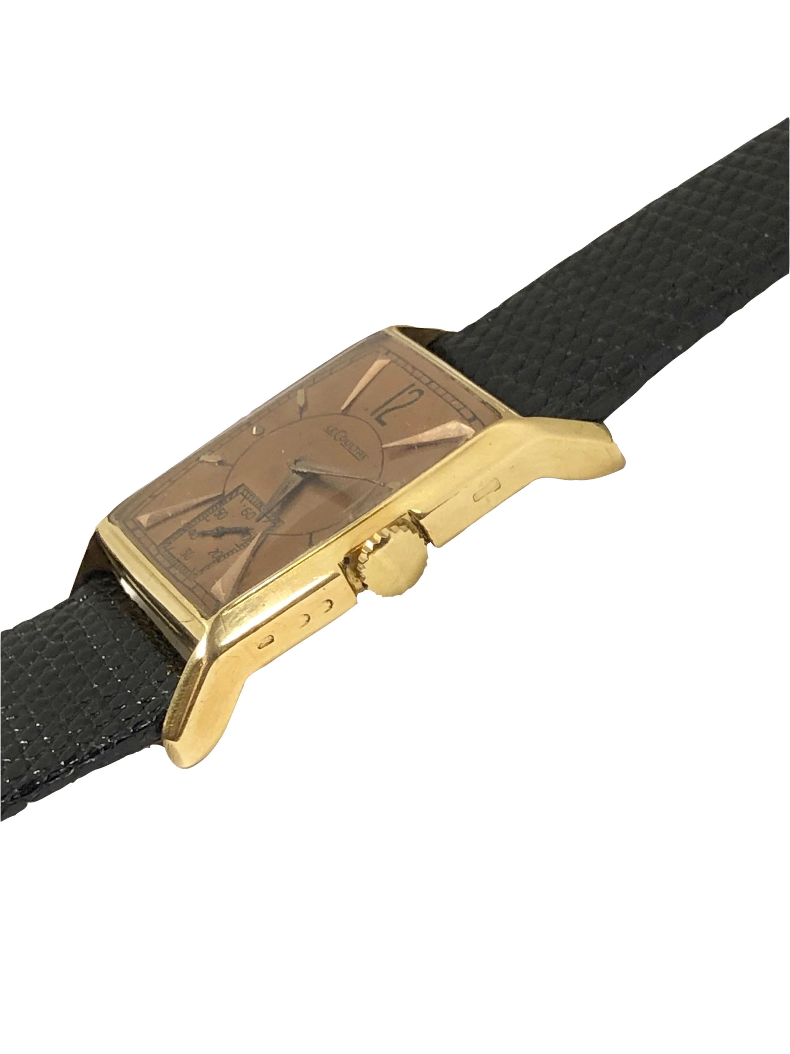 Circa 1940s LeCoultre Wrist watch, 37 M.M. ( lug end to end ) X 22 M.M. 2 Piece 18K yellow Gold Case, 17 jewel mechanical, manual wind movement, original Copper colored dial with raised Gold markers and a sub seconds chapter. New Black Lizard strap,