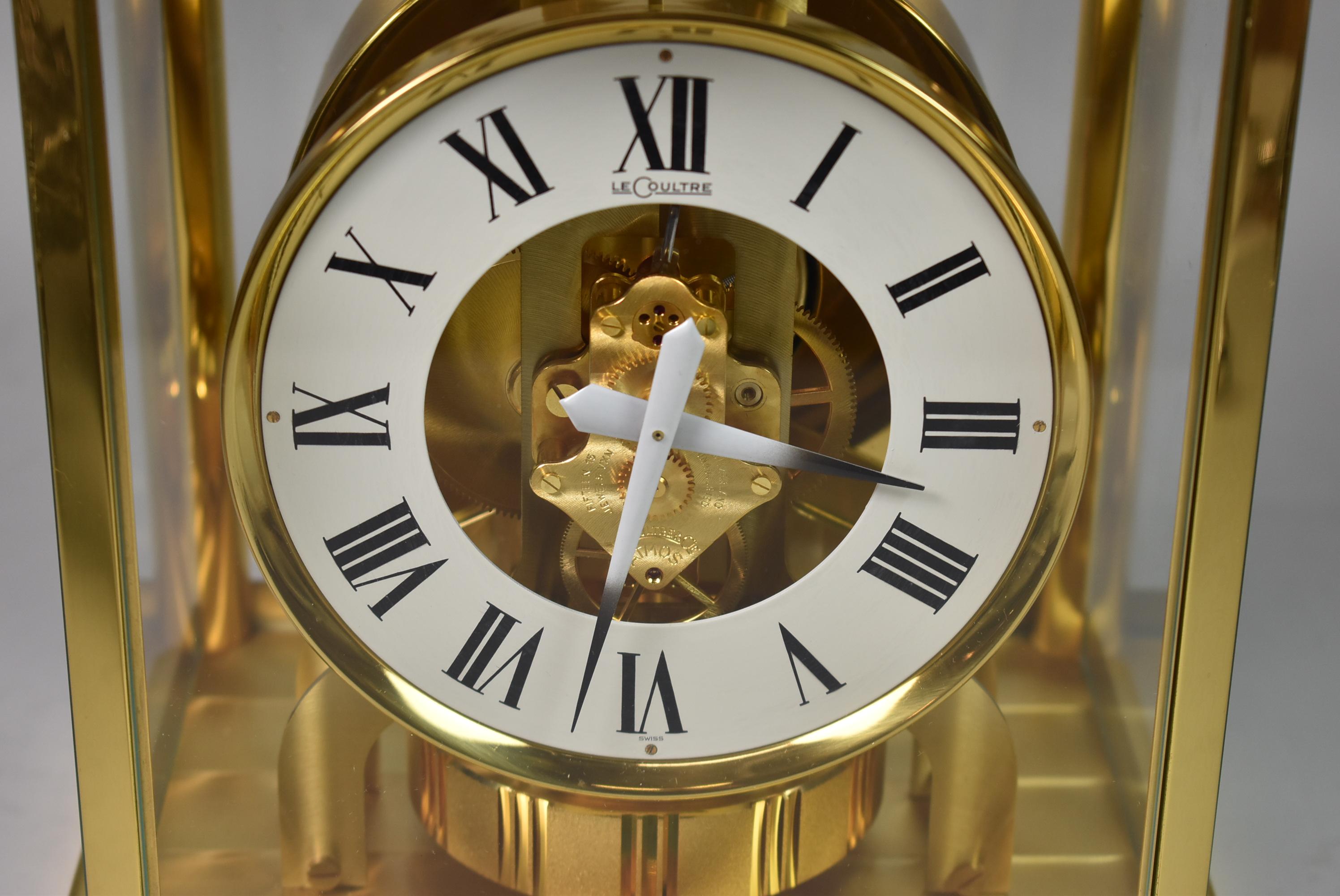 LeCoultre Atmos brass clock with a white dial and Roman numerals. Running condition. 15 jewels caliber 528-8 serial number 310644. Minor wear.