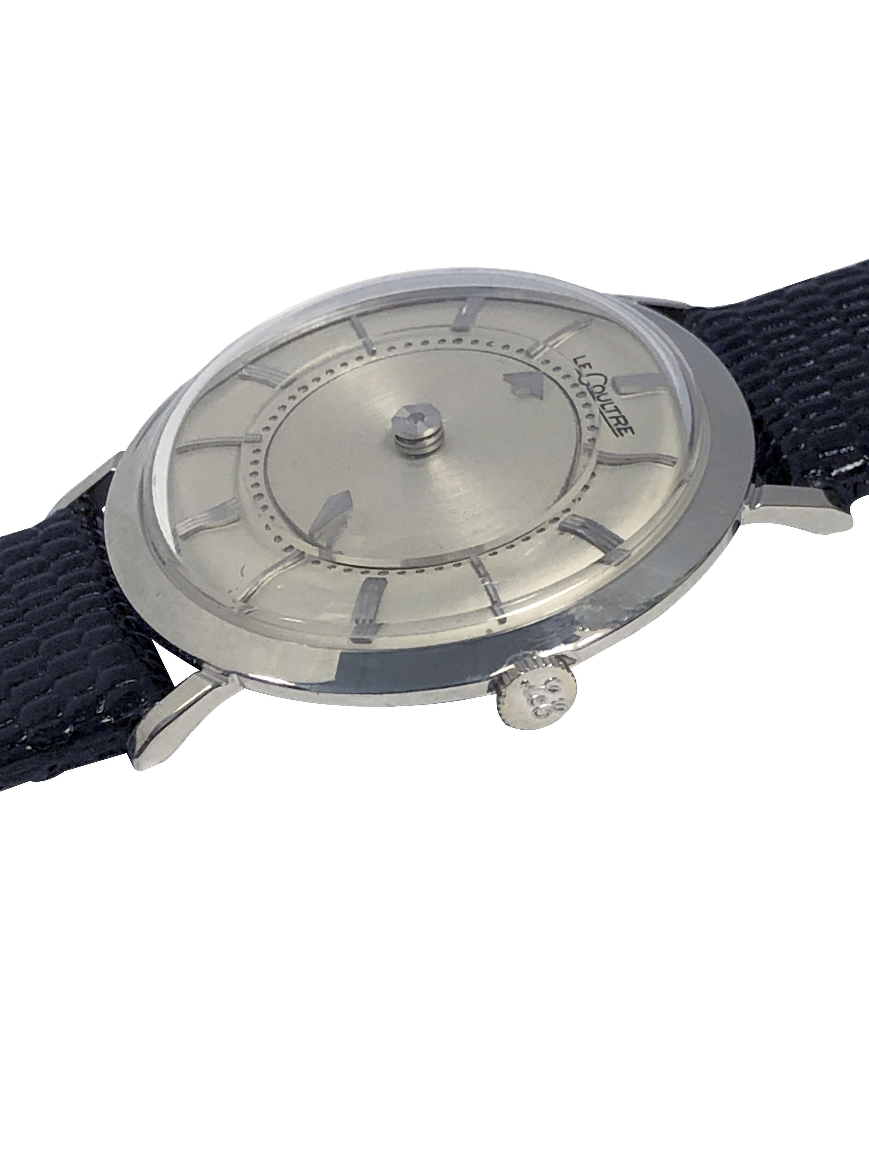 Circa 1960 LeCoultre Mystery ( floating dial ) Wrist Watch, 33 M.M. 10k White Gold Filled 2 Piece case, 17 Jewel, Mechanical, Manual wind movement. Original mint condition Silver Satin Dial with raised Gold Markers. New Black Lizard grain strap.