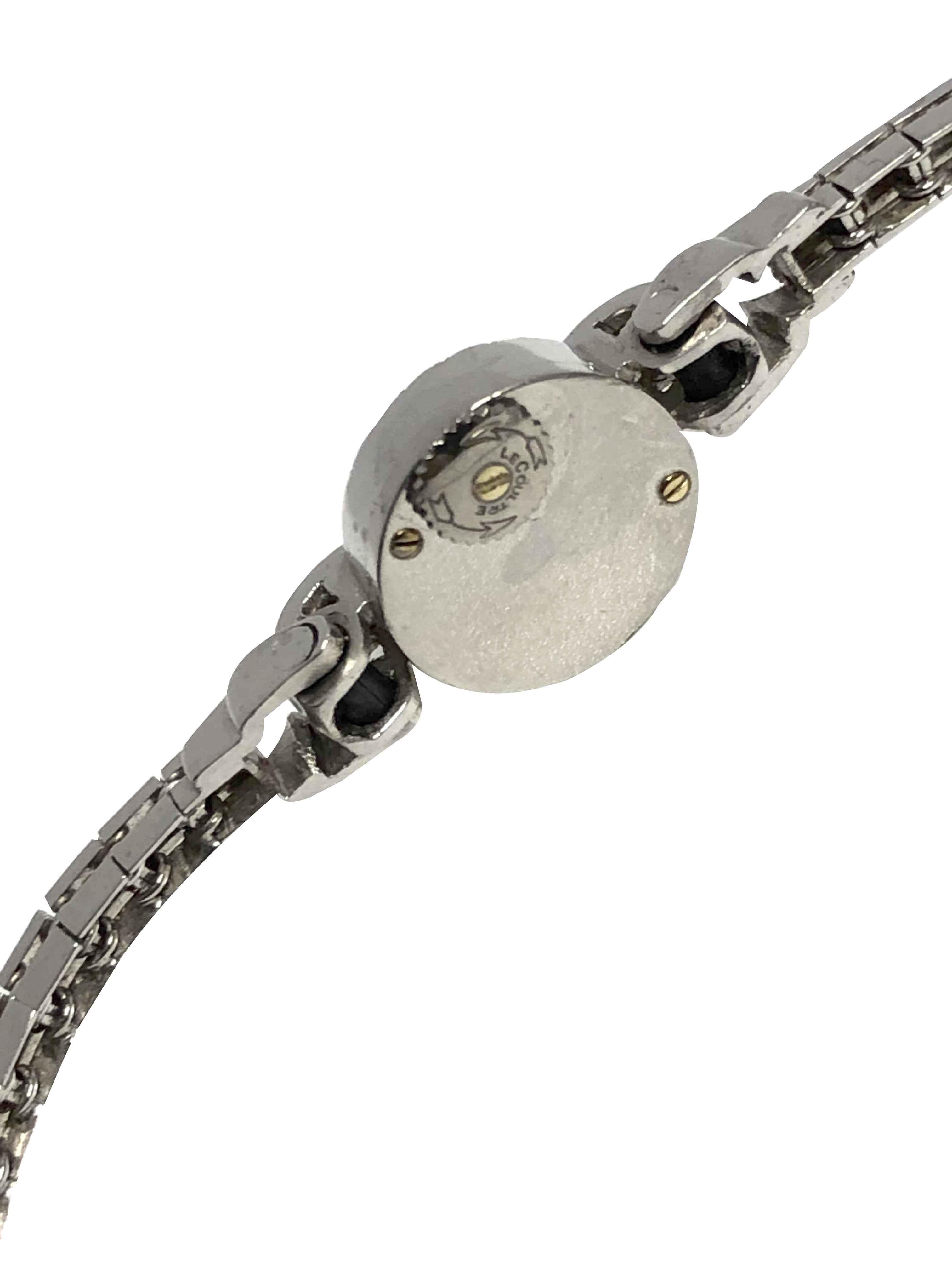 Circa 1940s LeCoultre Ladies Bracelet Wrist Watch, 13.5 M.M> Platinum 2 Piece Case with Diamond Bezel, 17 Jewel Mechanical Back wind and set movement, Silver satin dial with raised markers. 1/8 inch wide 14K White Gold Bracelet set with single cut