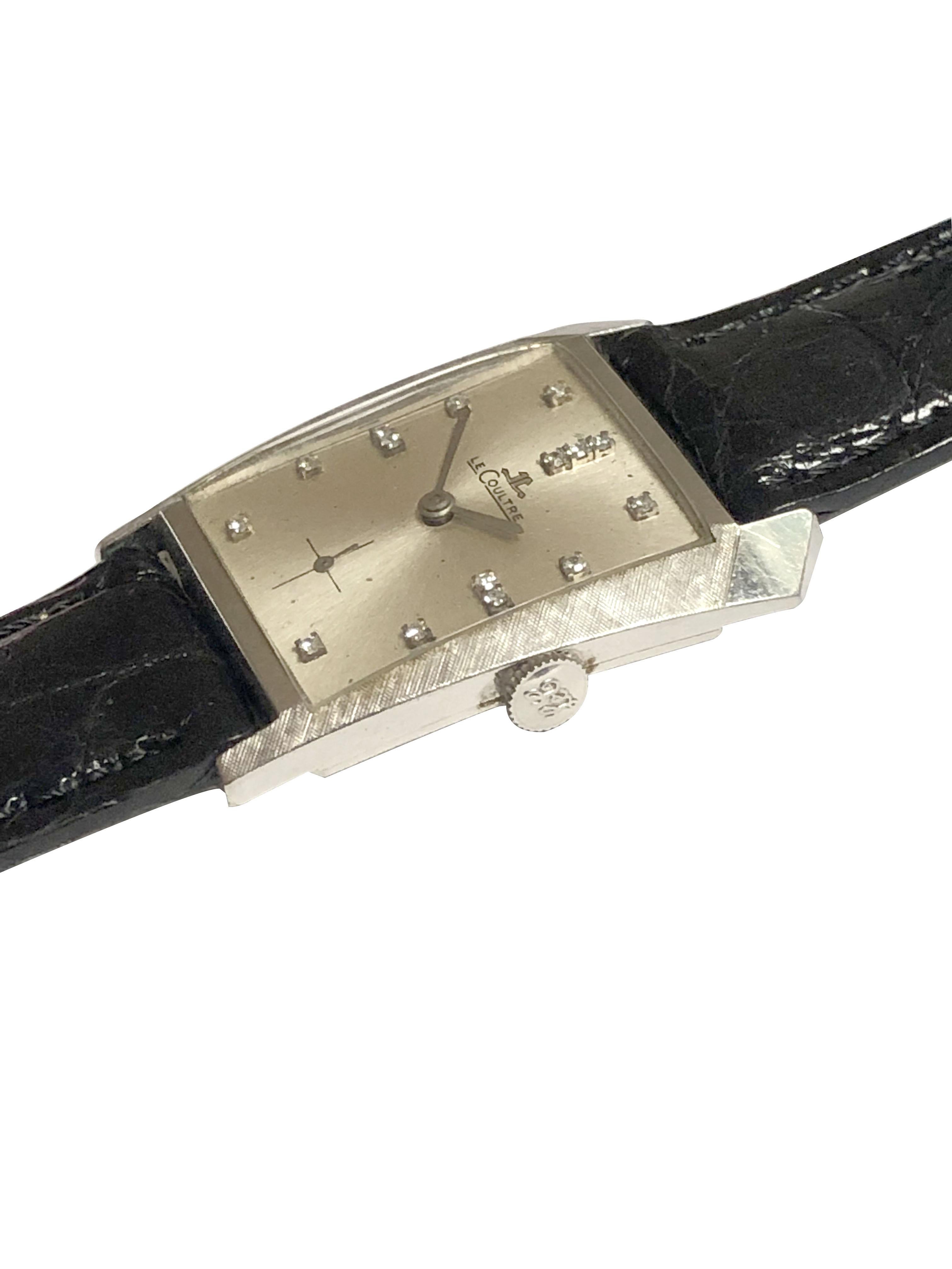 Circa 1960s LeCoultre Wrist Watch, 14K White Gold Asymmetrical 2 piece case measuring 34 X 17 M.M with Factory textured finish to the case top. LeCoultre 17 Jewel, mechanical, manual wind movement. Silver Satin Dial with Diamond set markers and a