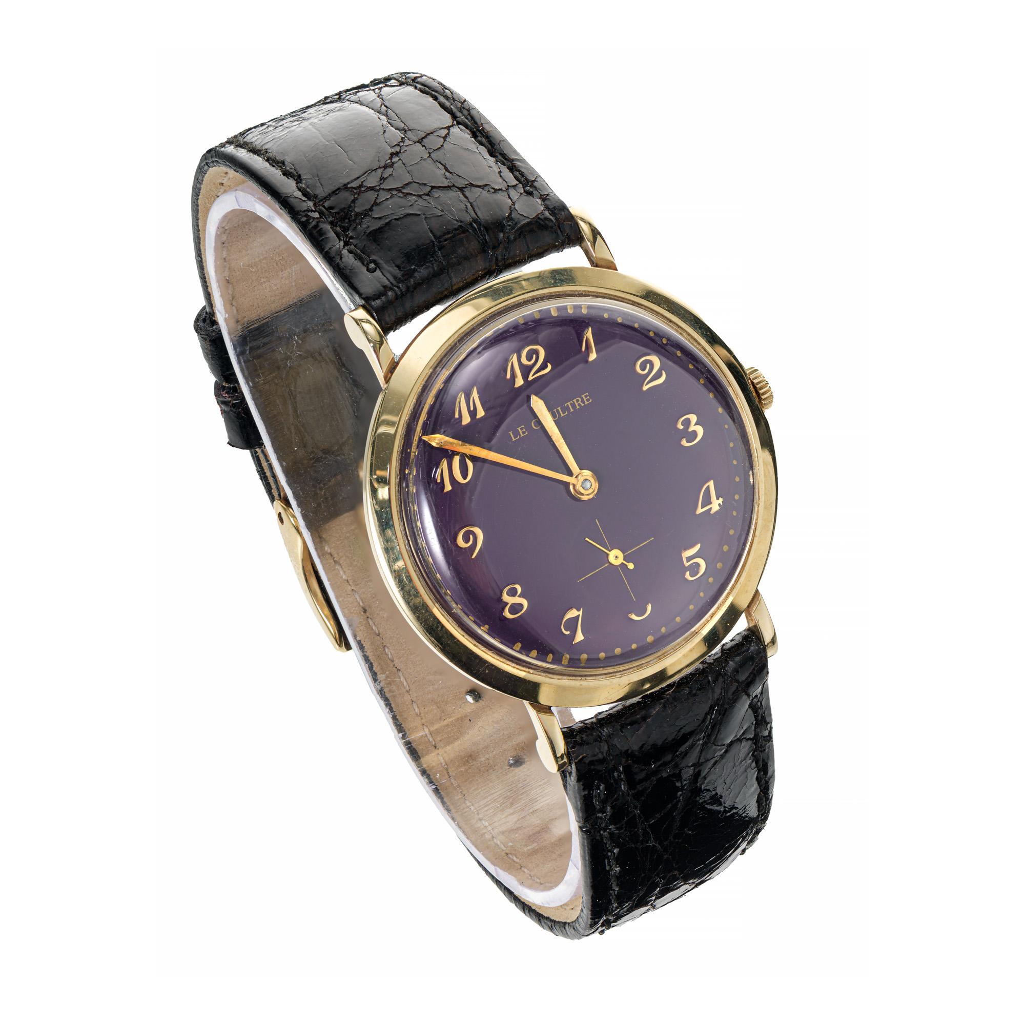 1960's LeCoultre 14k yellow gold wristwatch with custom-colored bright deep purple dial wristwatch. Classic LeCoultre men's wristwatch, with gold bezel and refinished, custom colored dial. Color not original to watch. Black strap. 

14k yellow