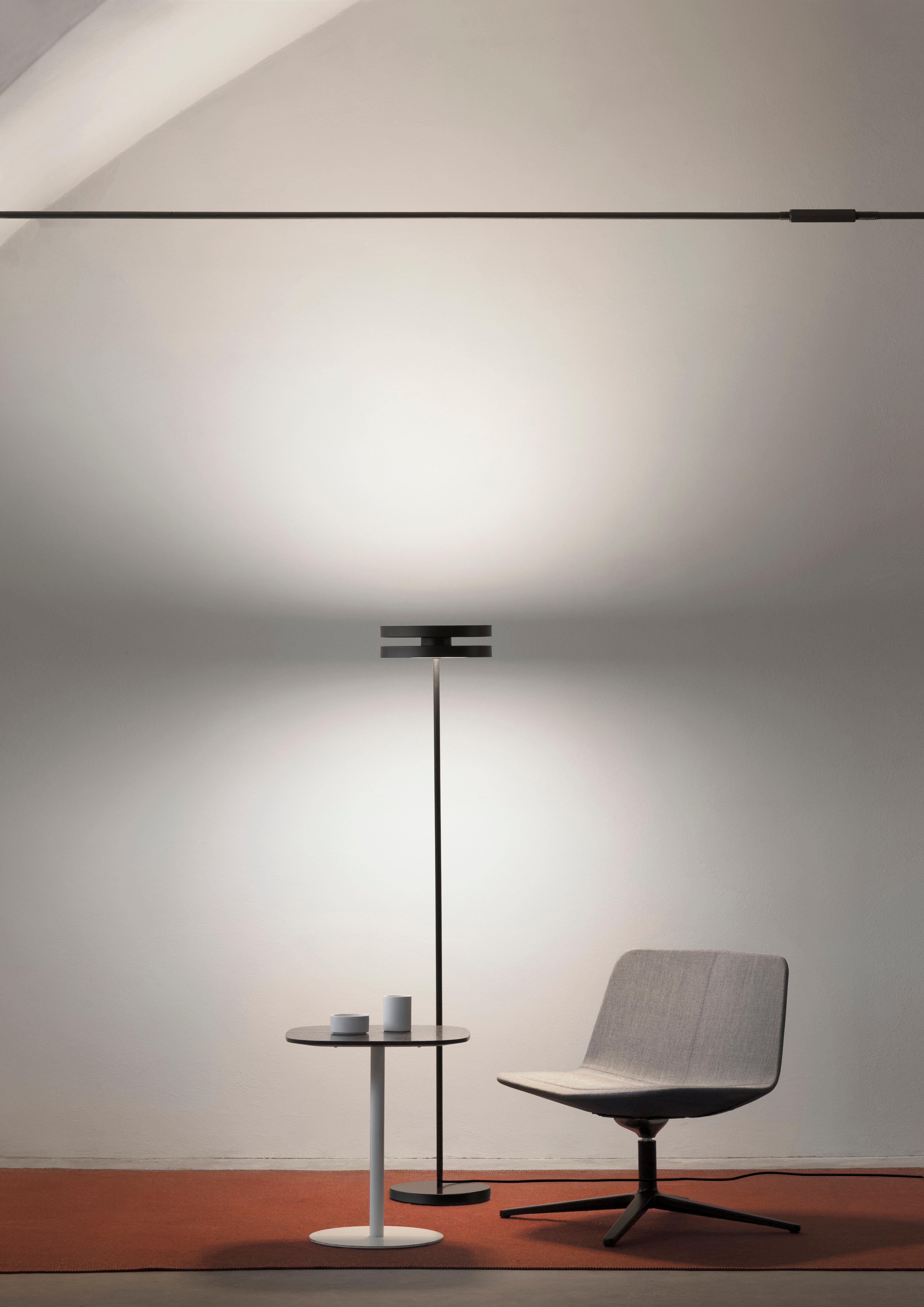A strict design defines the three models of the Led Machine collection: a suspended version, a floor lamp and a particular hanging variation with a latch scrolling system, ceiling attachment and wall power supply. 
The rigorous design demonstrates