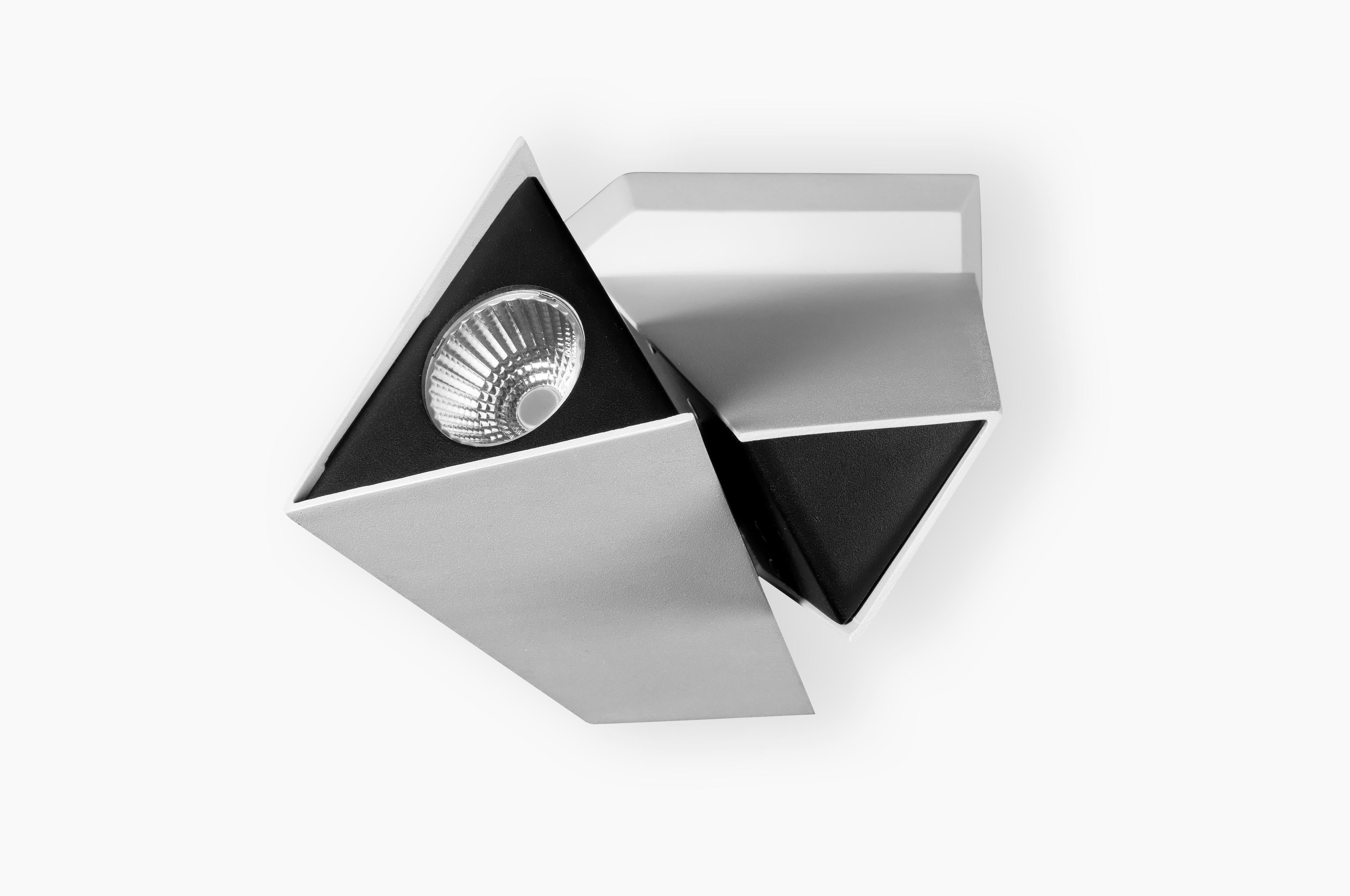 The LED Kite Spot by Axis71, designed by Gabi Paretto and Xugang Liu (2012), is a remarkable piece of contemporary lighting that combines innovative technology with elegant design. This versatile spot light features a sleek, minimalist aesthetic