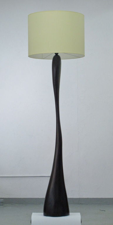 Tall sculptural standing lamp in ash with dark stain. Playful and fluid. Its organic arresting form is like a figure or a tree swaying in the wind it subtly conveys movement.

Signed.

 