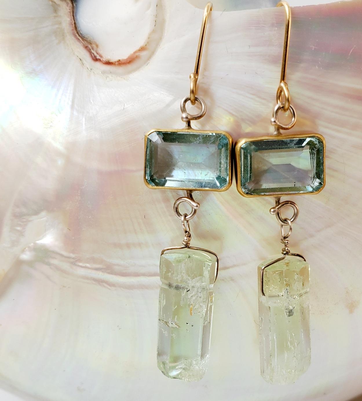 Glistening emerald cut aquamarine earrings with polished pale green beryl crystal drops. Slightly mis matched. Aquamarines, handset in 22K gold bezels, with cut out sterling silver backs. Sterling silver wirework and handmade 18K gold earwires.