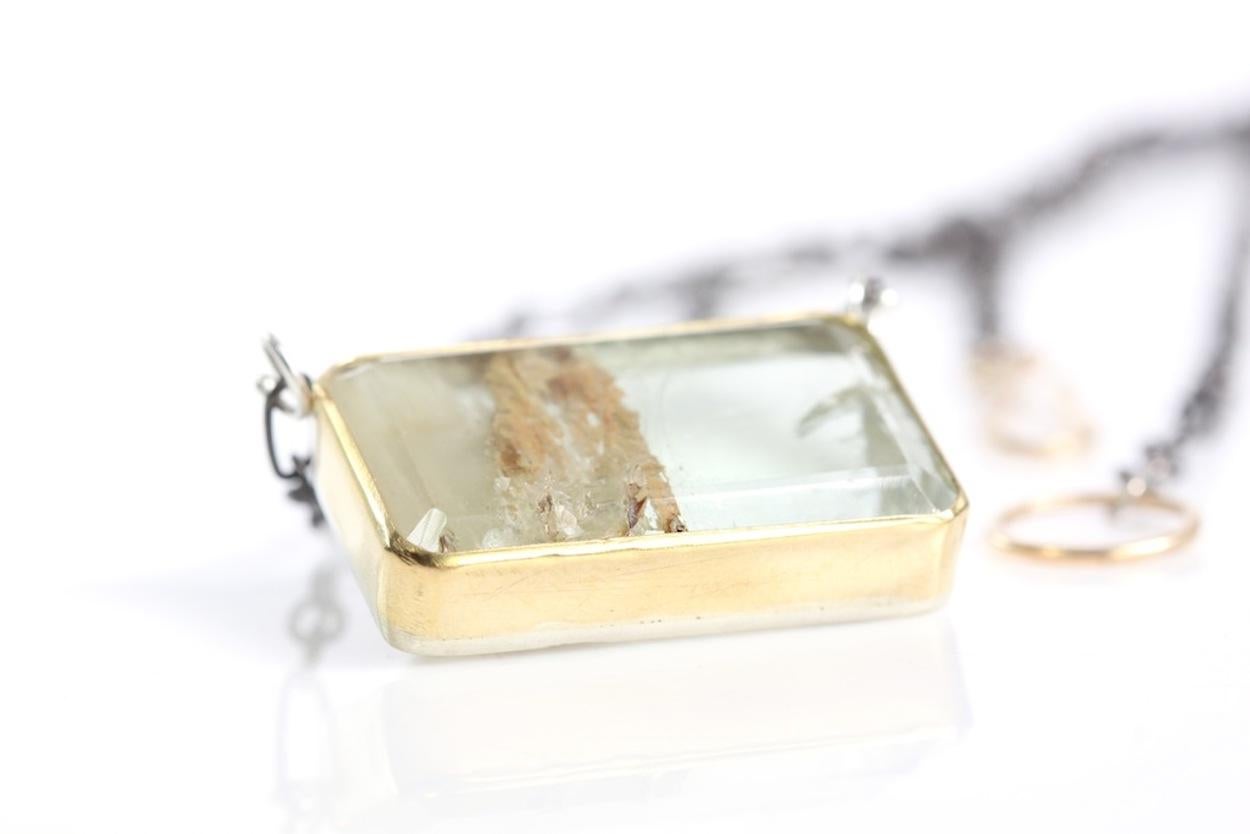BIG emerald cut green beryl pendant featuring unique inclusions. One of a kind beryl, emerald cut and set in a 22K gold bezel with a sterling silver cut out back.  Oxidized sterling silver chain and handmade 18K gold hook clasp. Emerald cut beryl: