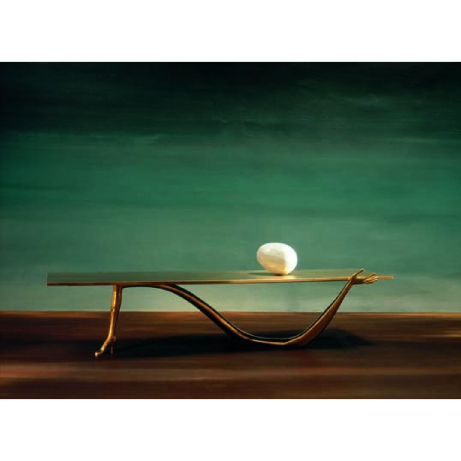 Leda low table, Salvador Dalí 
Design inspired on an artwork by Salvador Dalí
Dimensions: 51 x 190 x 61 H cm
Materials: brass, marble

Design inspired on an artwork by Salvador Dalí: ‘Femme à tête de roses’ (1935). 
Legs in cast varnished