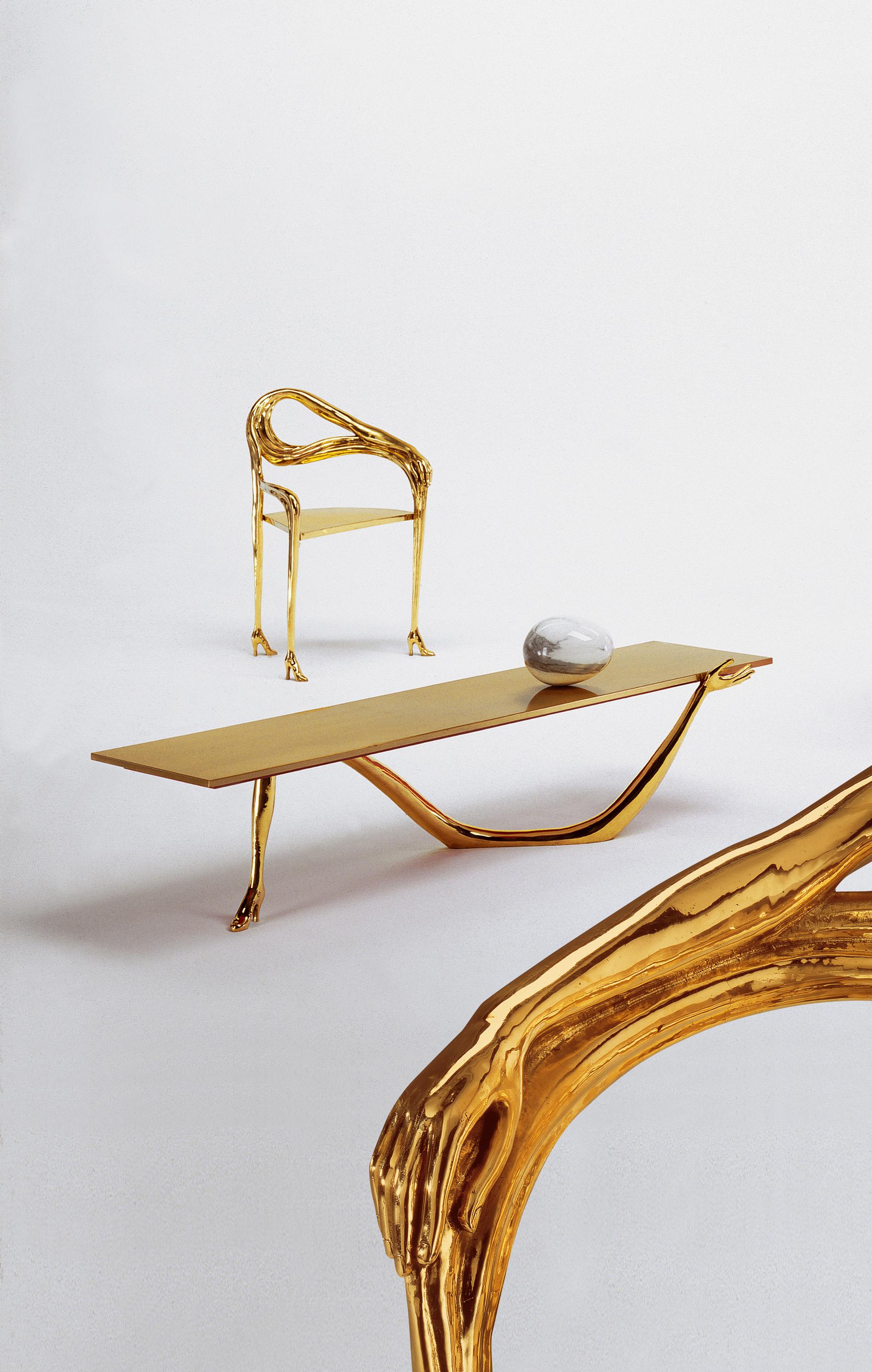 Coffee table
Spain, 1935/37
DIMENSIONS:
Table: 1900x451xh.420mm;
Table with egg: 1900x451xh.610mm

Legs in a cast varnish brass.
Table top in brushed and varnished brass.
Carrara marble egg on top.

Taken from “Femme à tête de roses