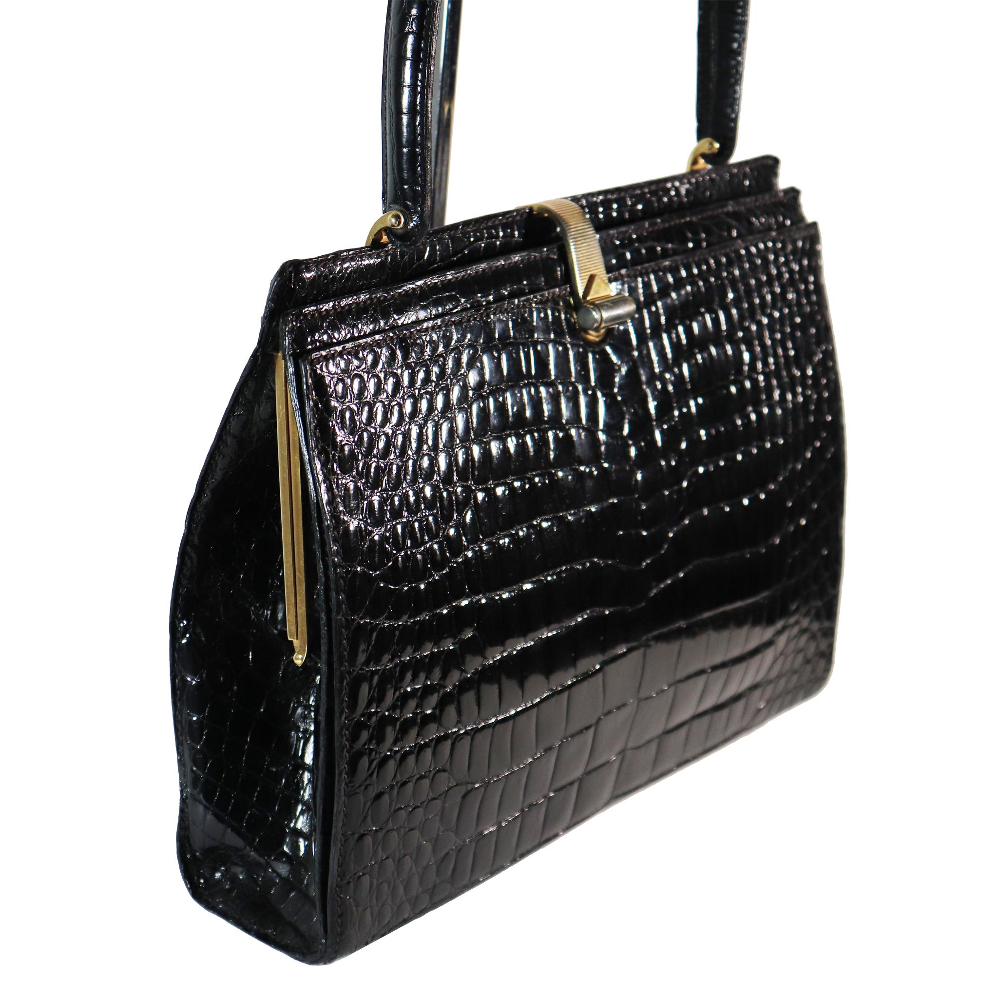 Lederer Black Alligator Purse W/ Gold Hardware & Expandable Frame. In Excellent condition 

Very Rare and Stylish handbag 

Measurements: 

Height - 8.5 Inches 
Width - 11 Inches 
Height - Strap - 14.5 Inches 