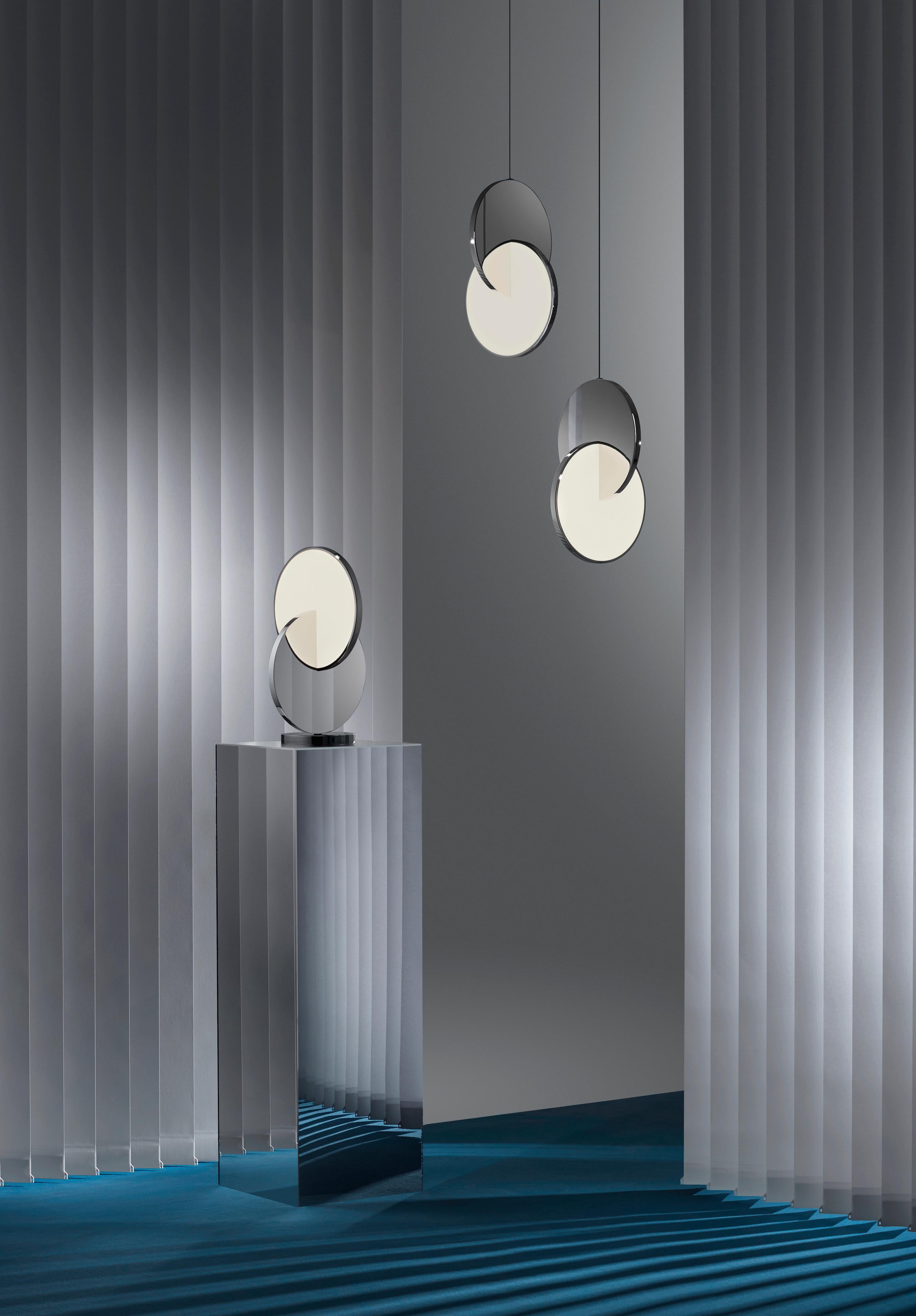 ECLIPSE PENDANT LIGHT POLISHED CHROME
Eclipse Pendant is celestial in both its name and inspiration. Mirror-polished gold and acrylic discs interact, dissect and obscure, which both eclipses and reveals its illumination to the viewer at the same