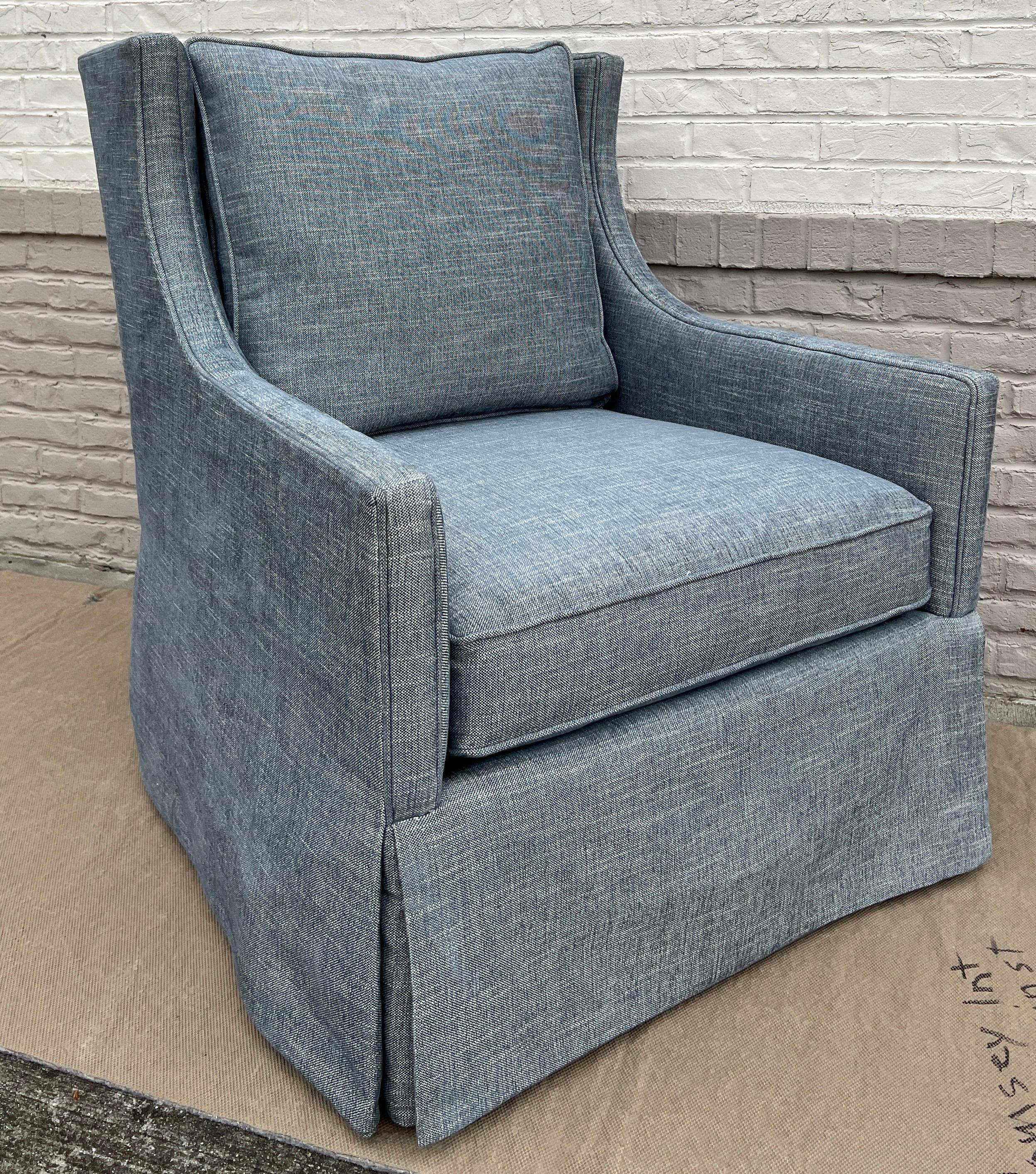 Custom made Lee Industries, Inc. 1211-01 Swivel Chair (2 available). These chairs are showroom new and have never been used.

Upholstered in a blue slubby woven chenille performance fabric, skirted to hide the smooth swivel mechanism. The high back