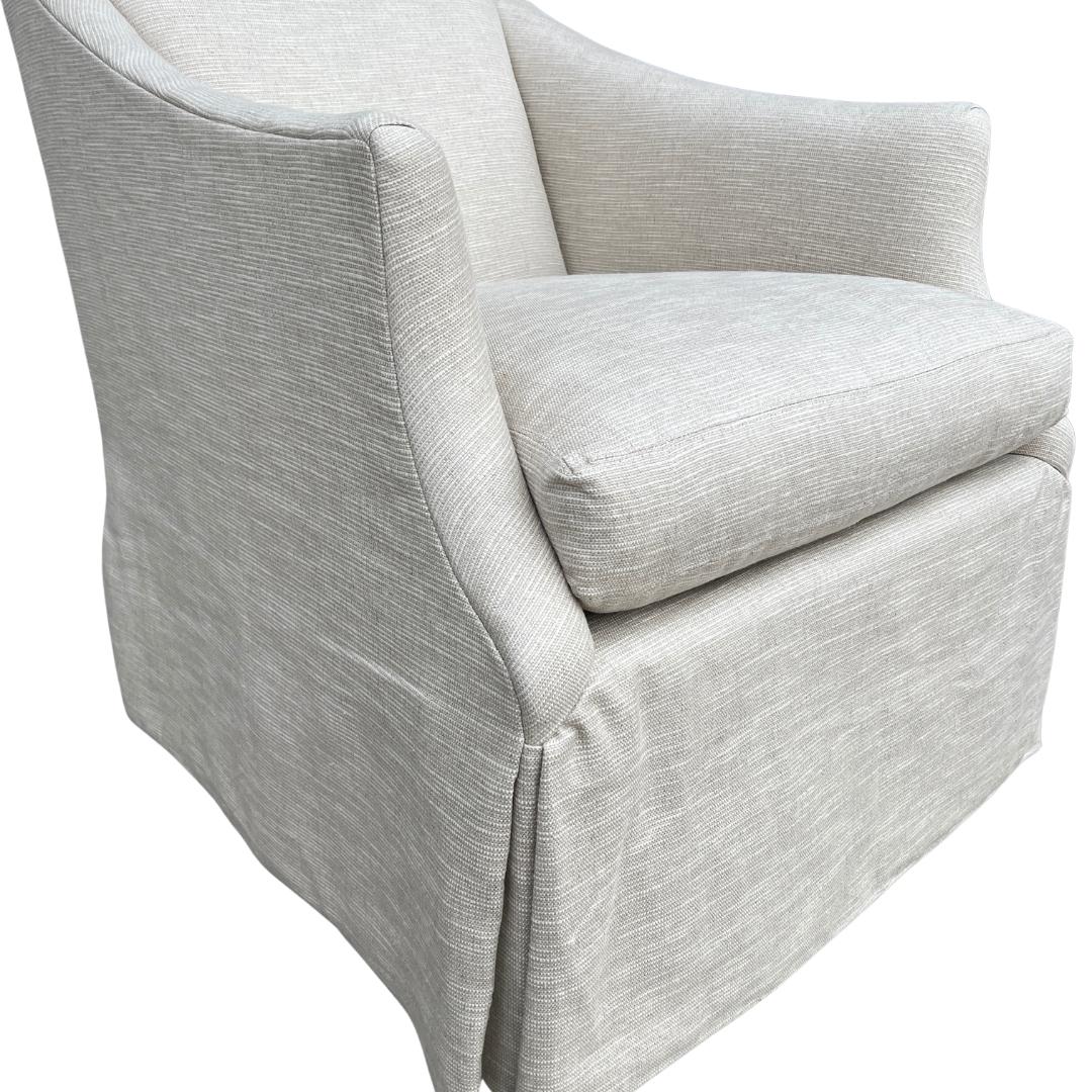 Custom made LEE Industries 1931-01 Swivel Chair (2 available). These chairs are showroom new and have never been used.

This tailored swivel is wonderfully stylish from every angle. The slim arms, classic skirt, and gently sloping silhouette bring a